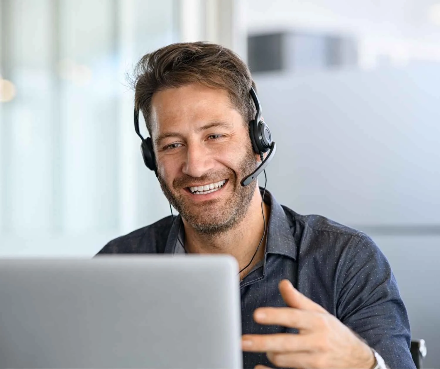 man smiling during a telehealth appointment