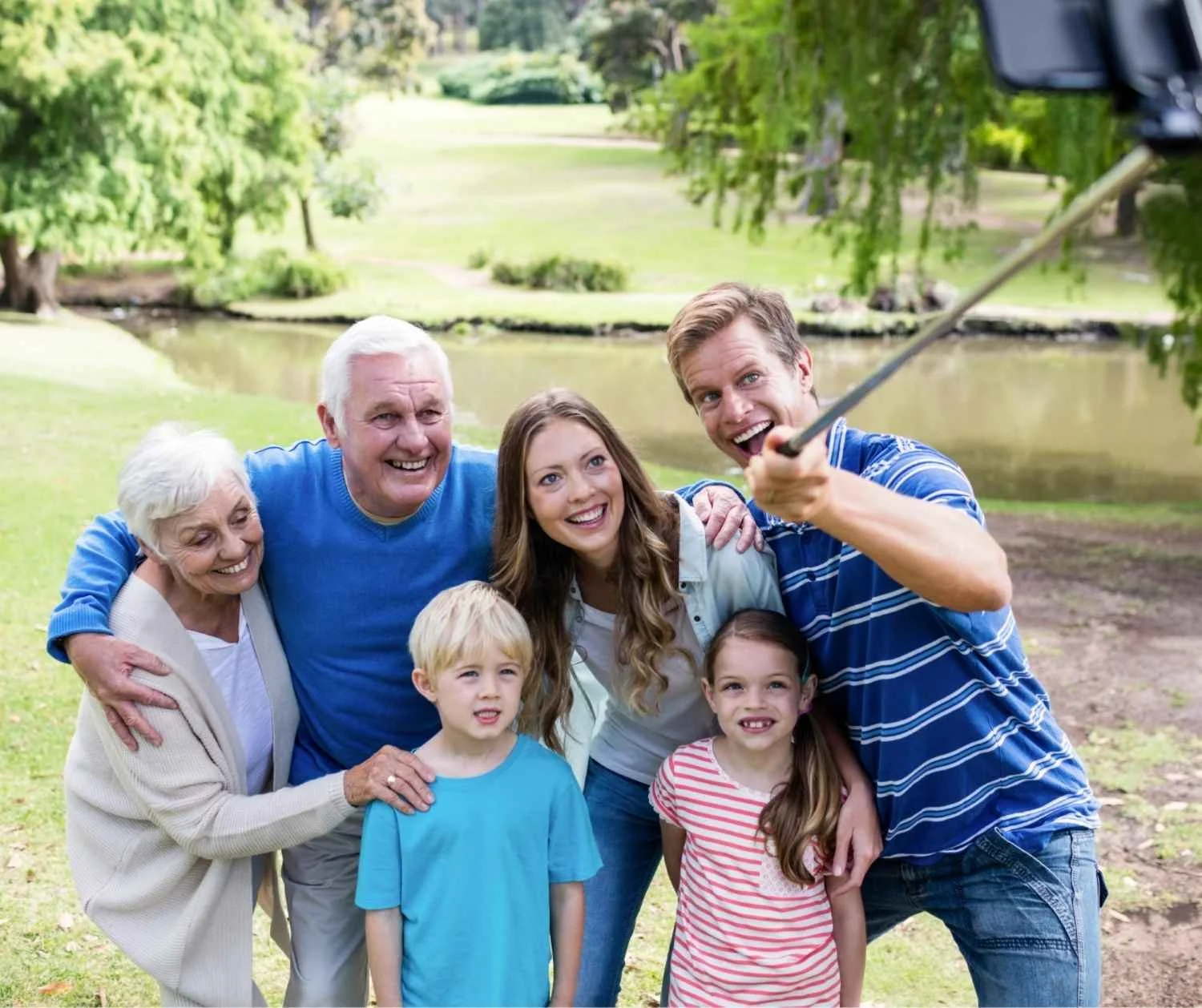 A multi-generation family selfie outdoors