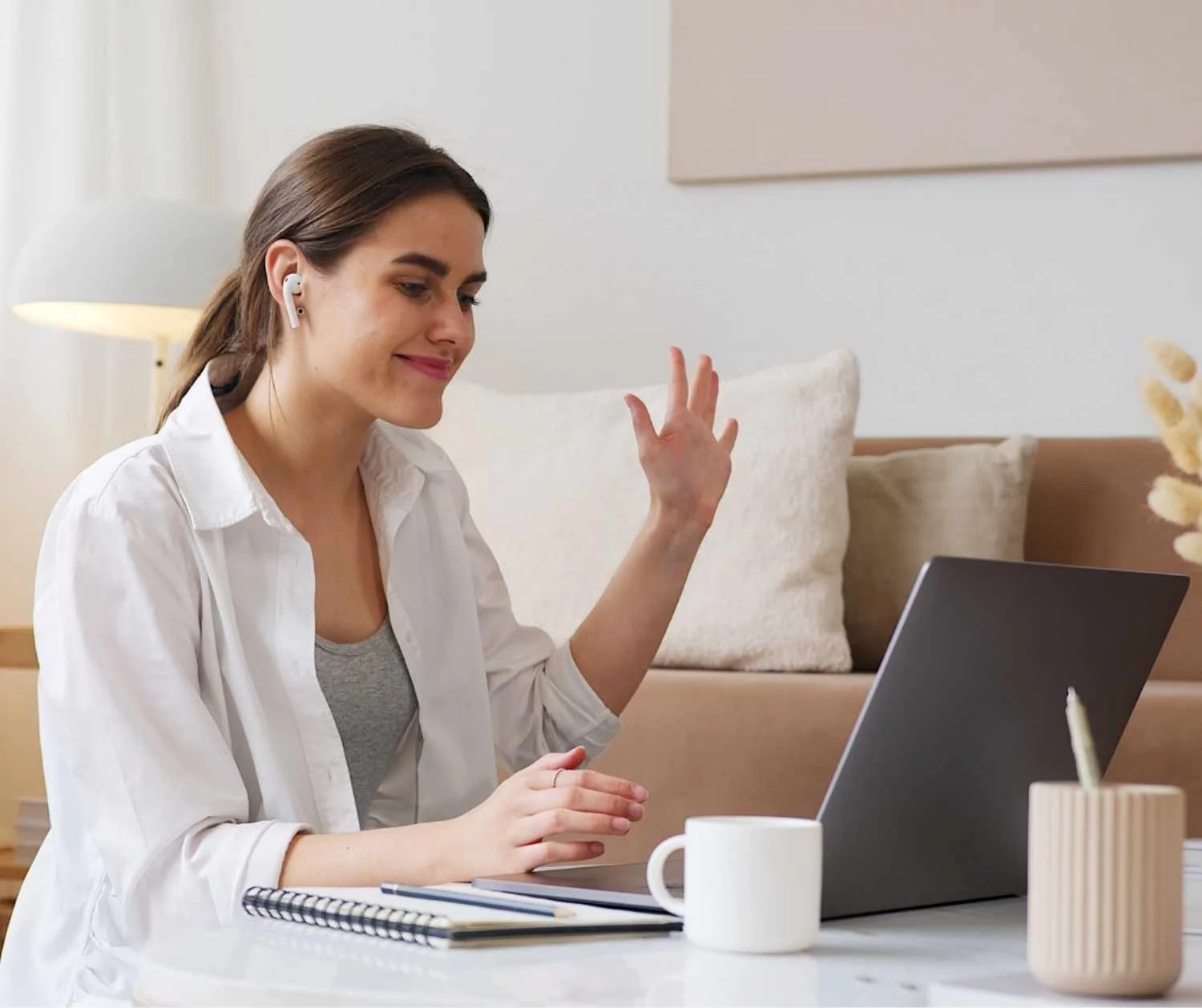 adult on laptop video call from home