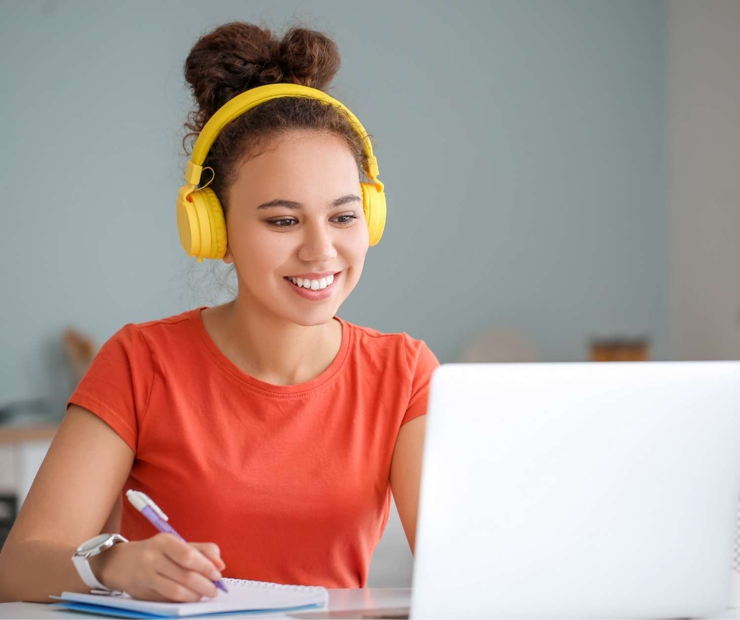 a person at a laptop at home in an online session