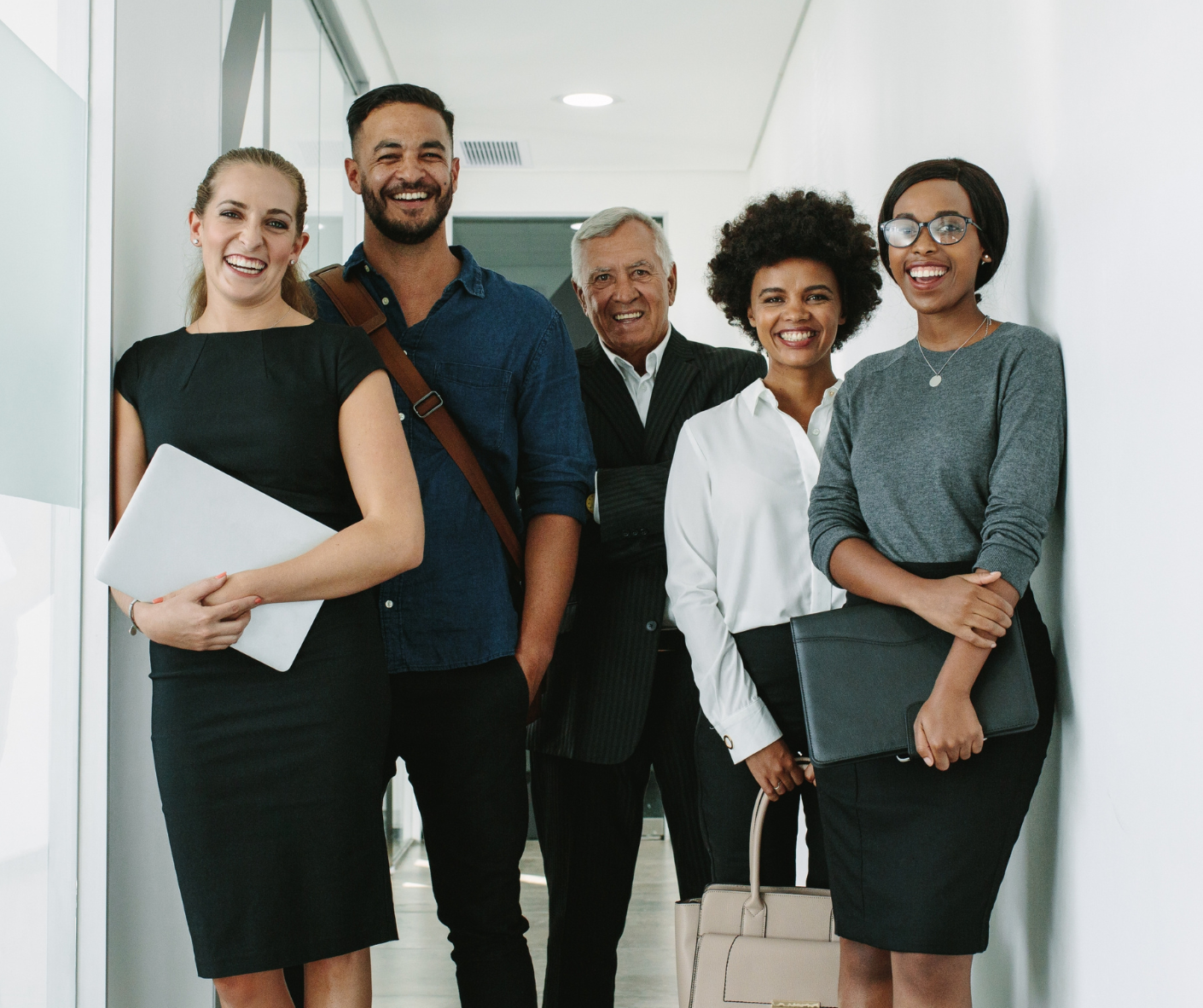 Group of executives and managers standing together in an office