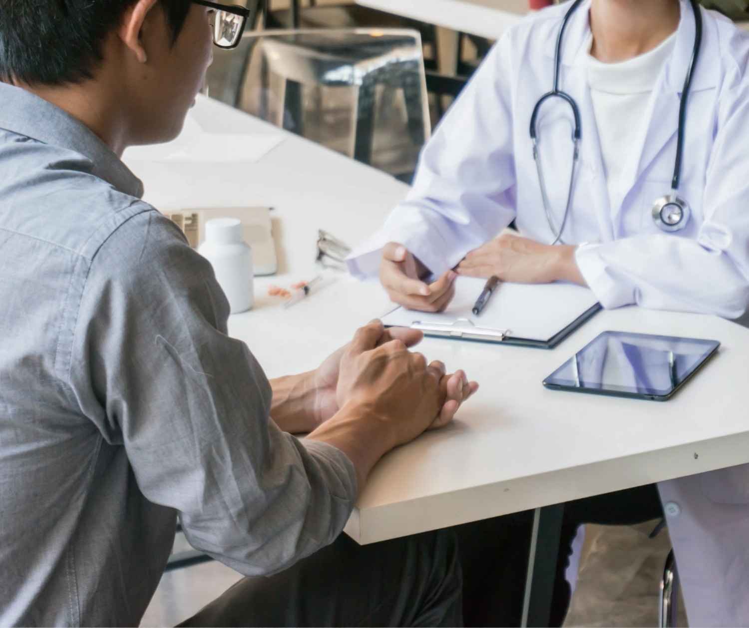 Adult talking with a doctor about a nasal-sounding voice