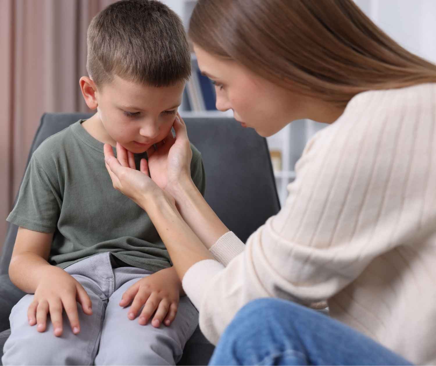 Mother talking with worried son at home