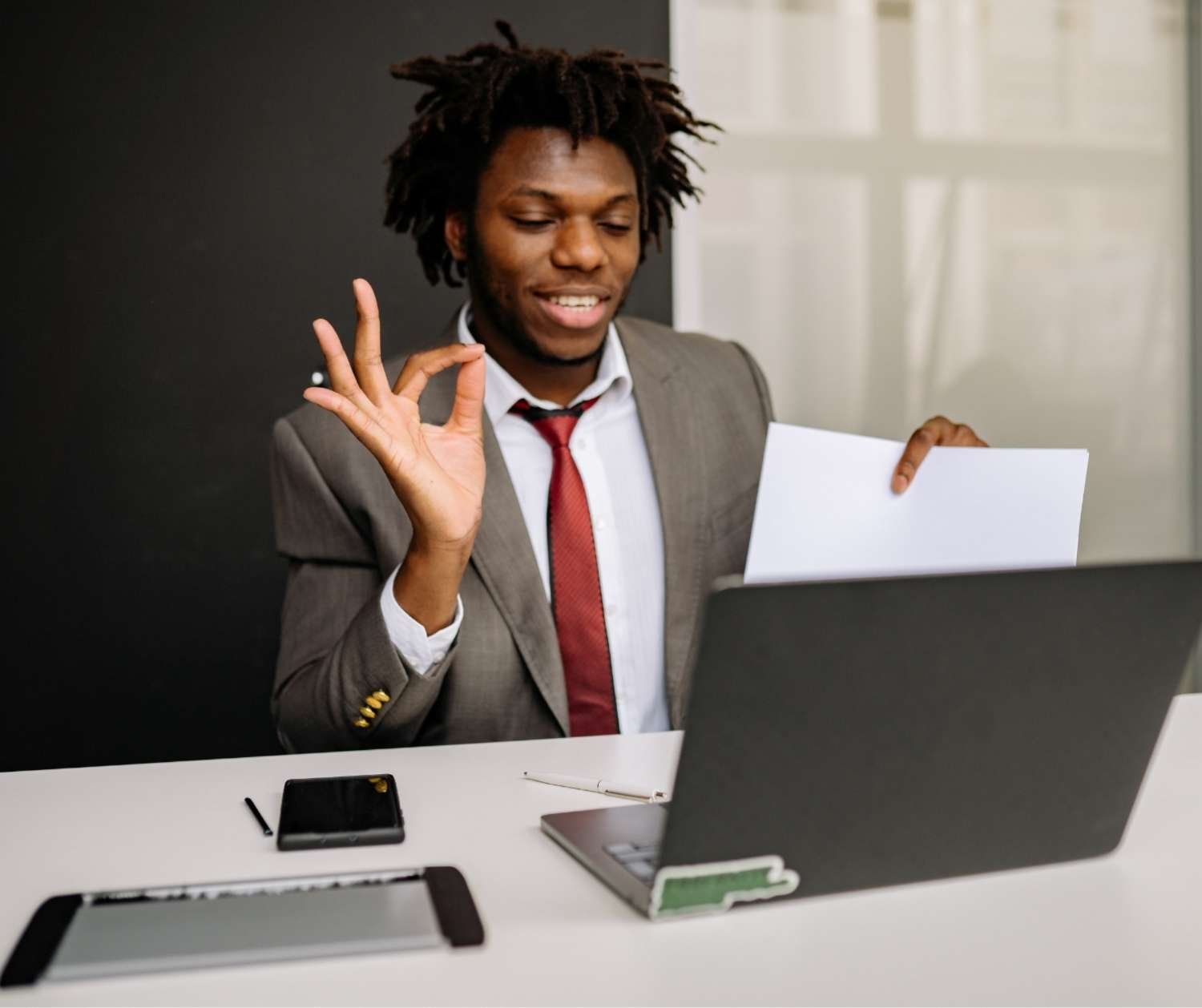 Man practicing a work conversation with his communication coach in an online session