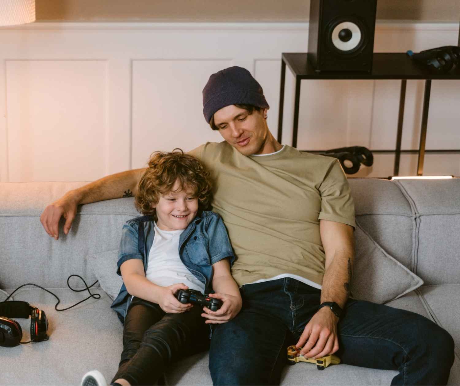 Father crouching down to talk with his young son