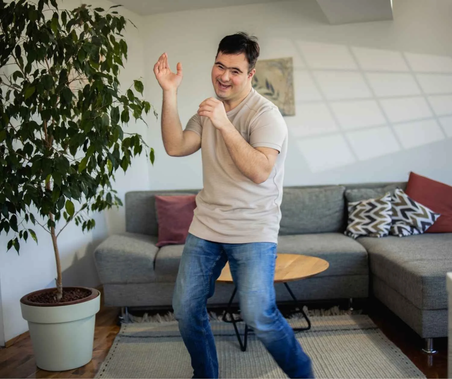 young man with disability in the living room
