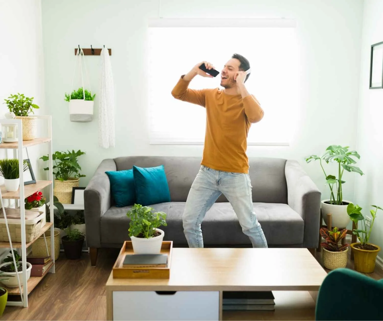 Man singing happily in his living room