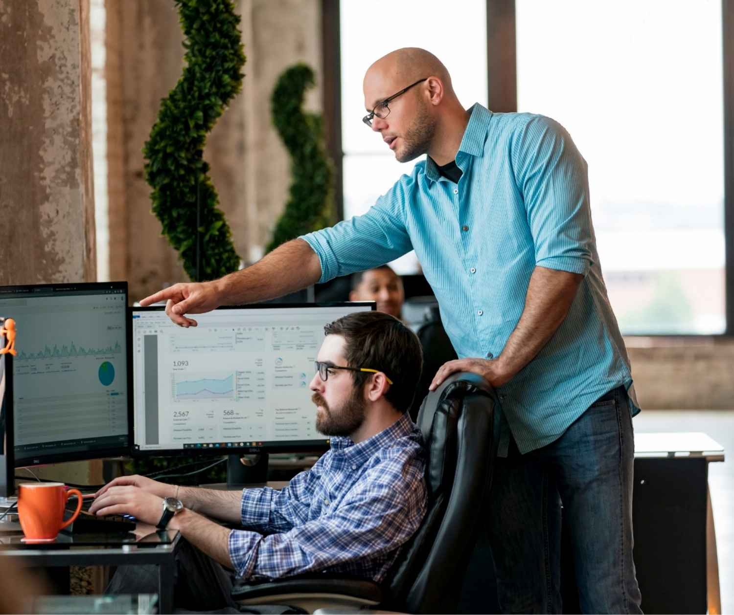 Two team members disagreeing about a plan during a meeting