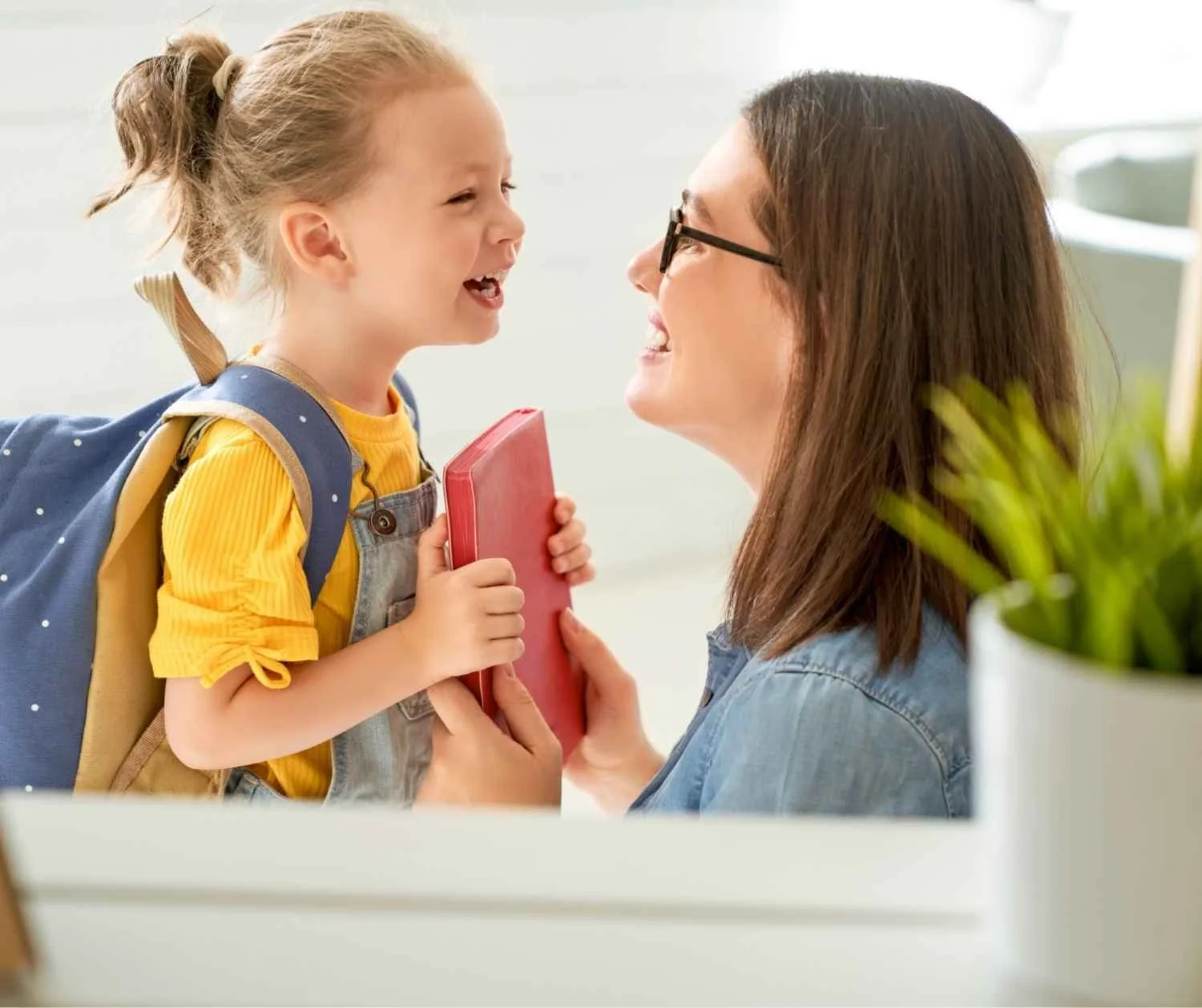 preschool girl talking to parent close up, bright home