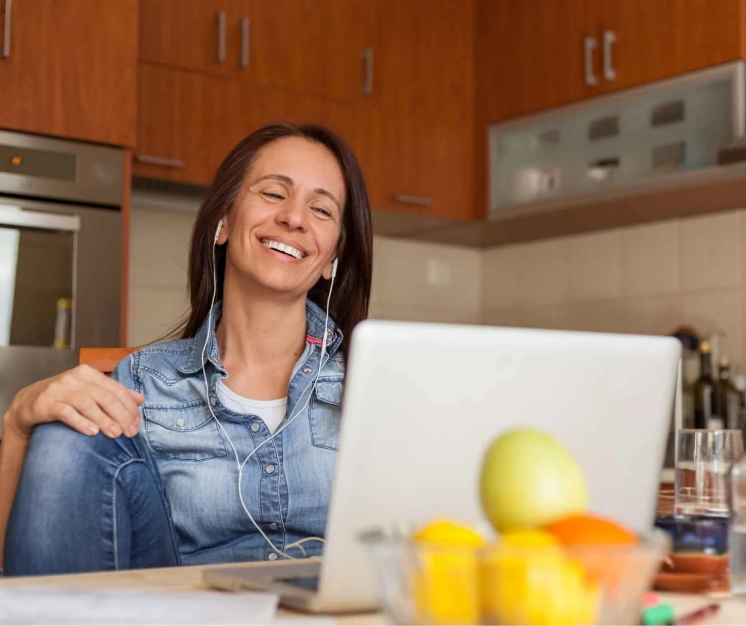 adult woman about 40 talking warmly with someone at home, soft light