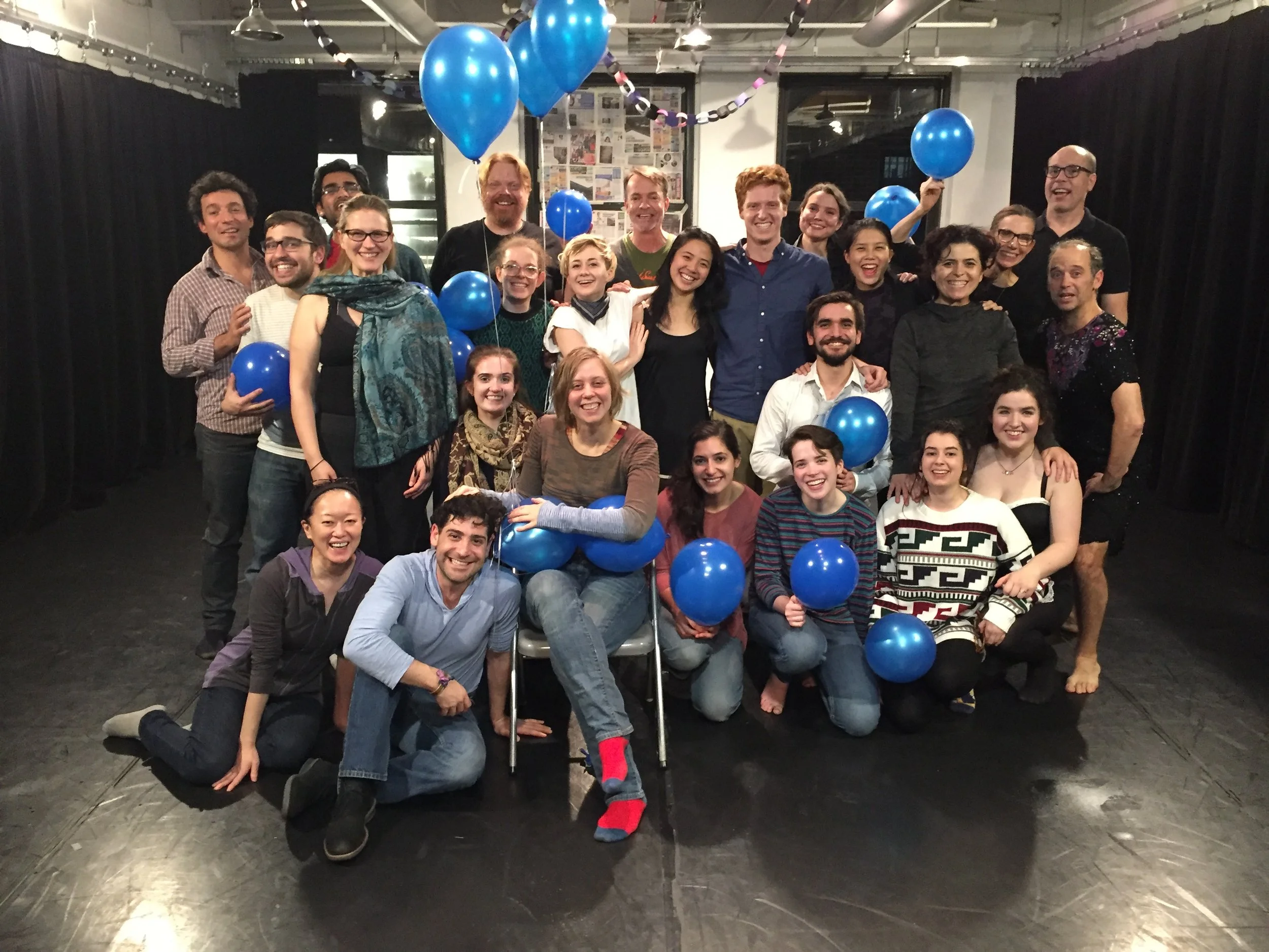 Kate Tarker surrounded by students from SITI Conservatory after their final presentations
