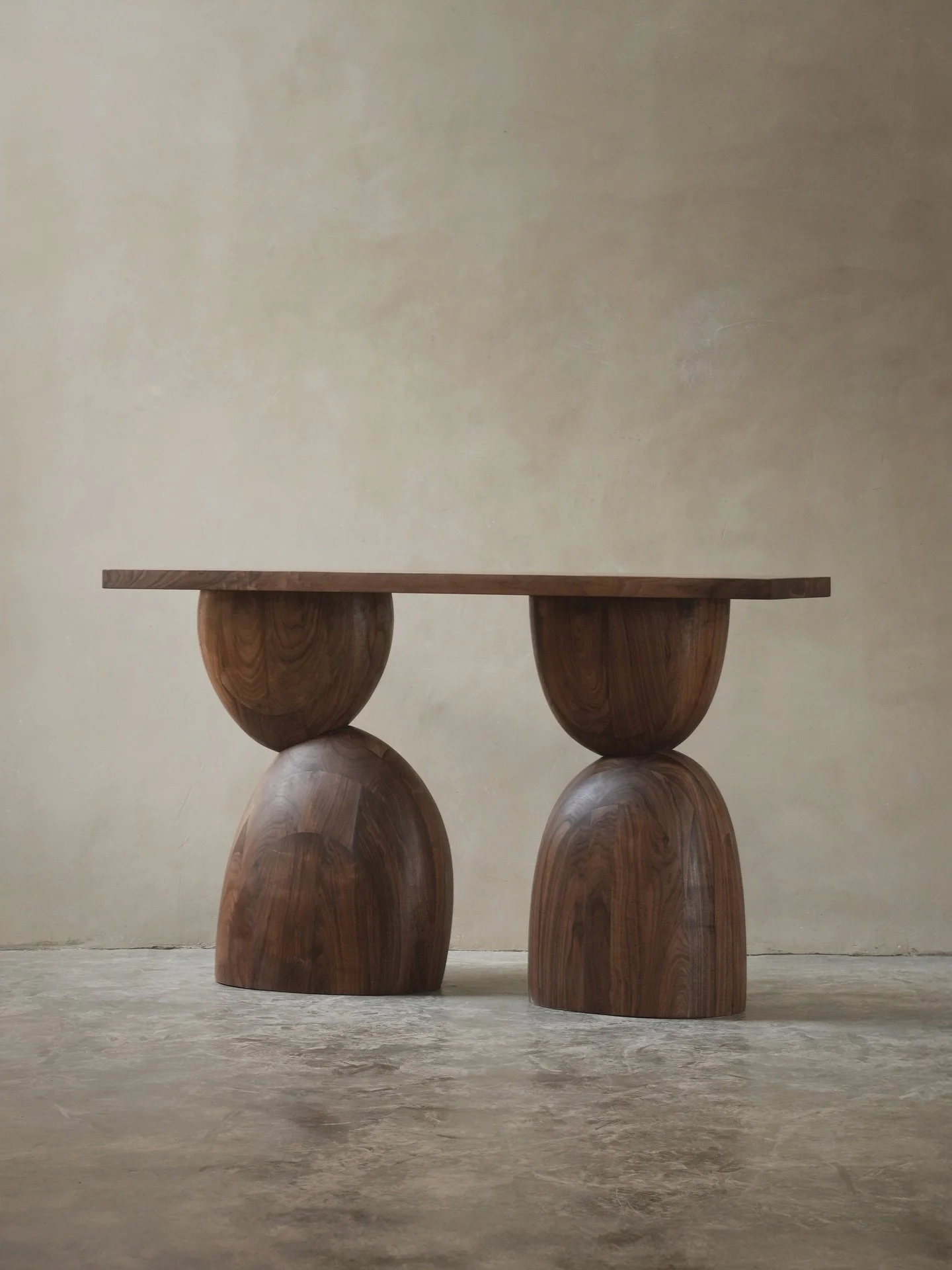 Creating the Elefante Sideboard, we focused on the interplay between light and shadow. The bold lines and sturdy construction are softened by the natural beauty of walnut wood, making this piece a perfect blend of Brutalist strength and organic elega