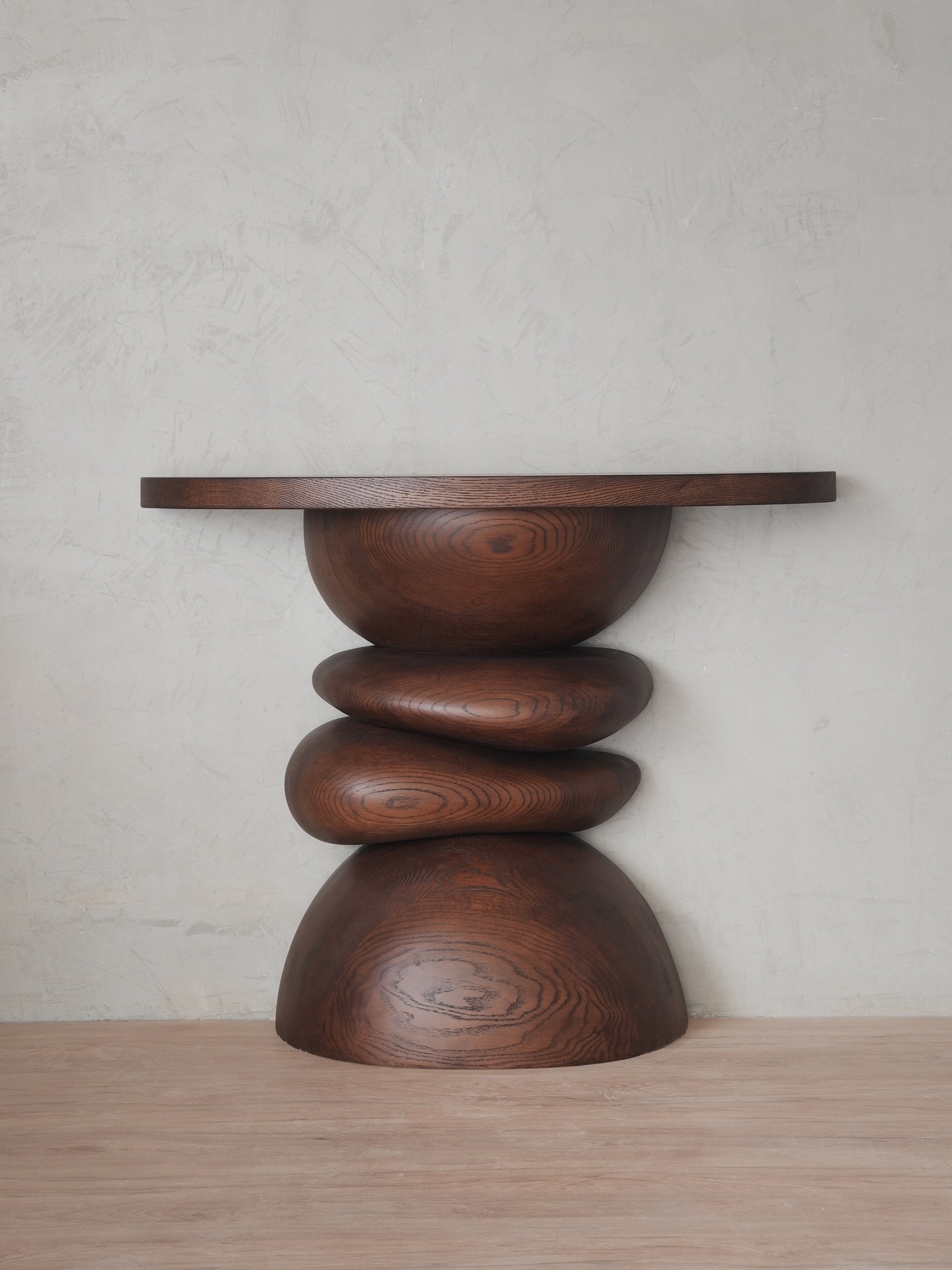 Elefante Console Table is designed to be both functional and beautiful. The round shapes and clean lines create a visually pleasing piece that also serves as a practical addition to your home, inspired by the serene and elegant designs of Luis Barrag