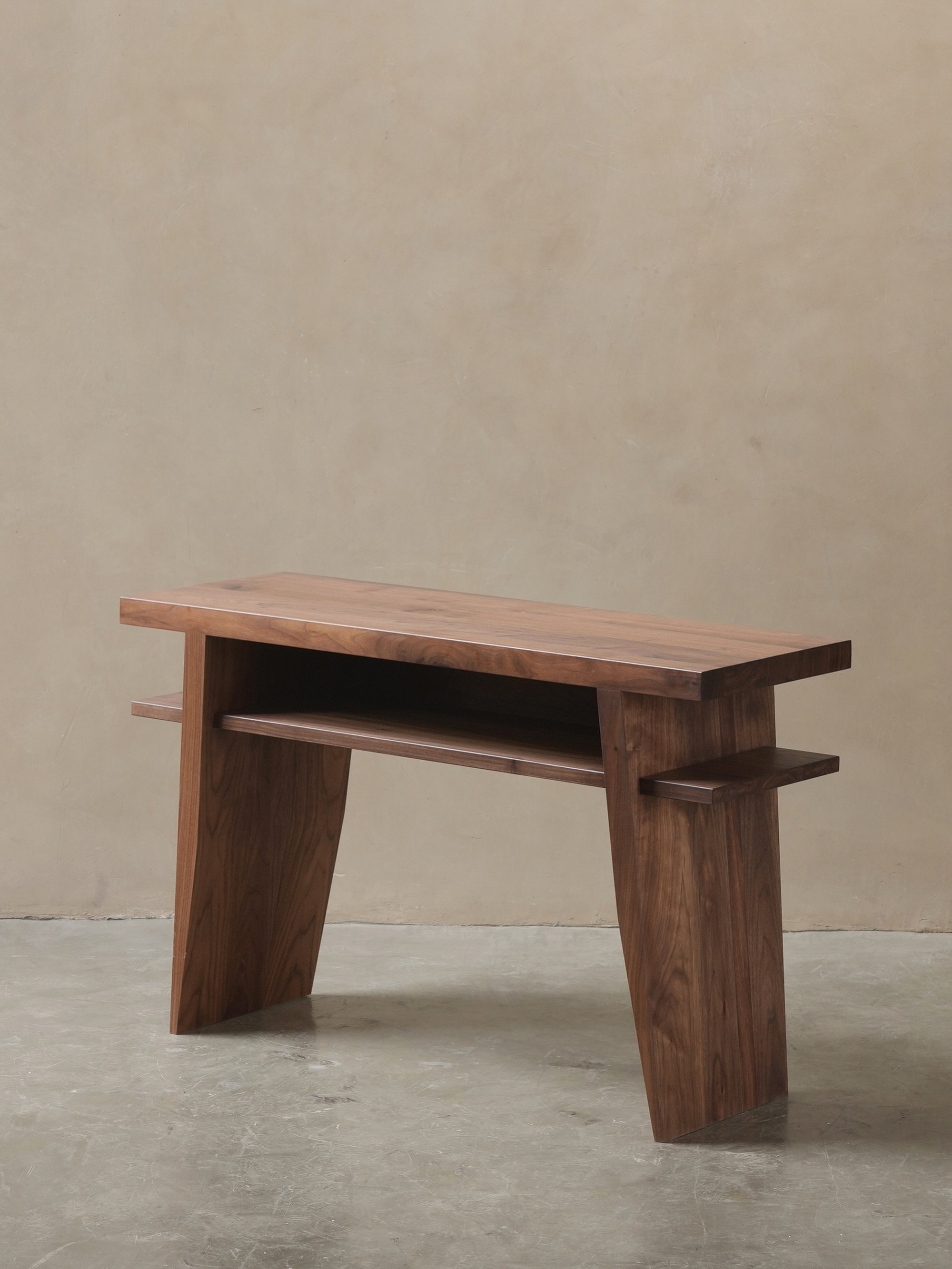 Fundamenta in walnut looks simple at first, but it is not a simple piece. The lines stay calm, but the form has more going on than it first shows.

#console #solidwood #interiordesign
