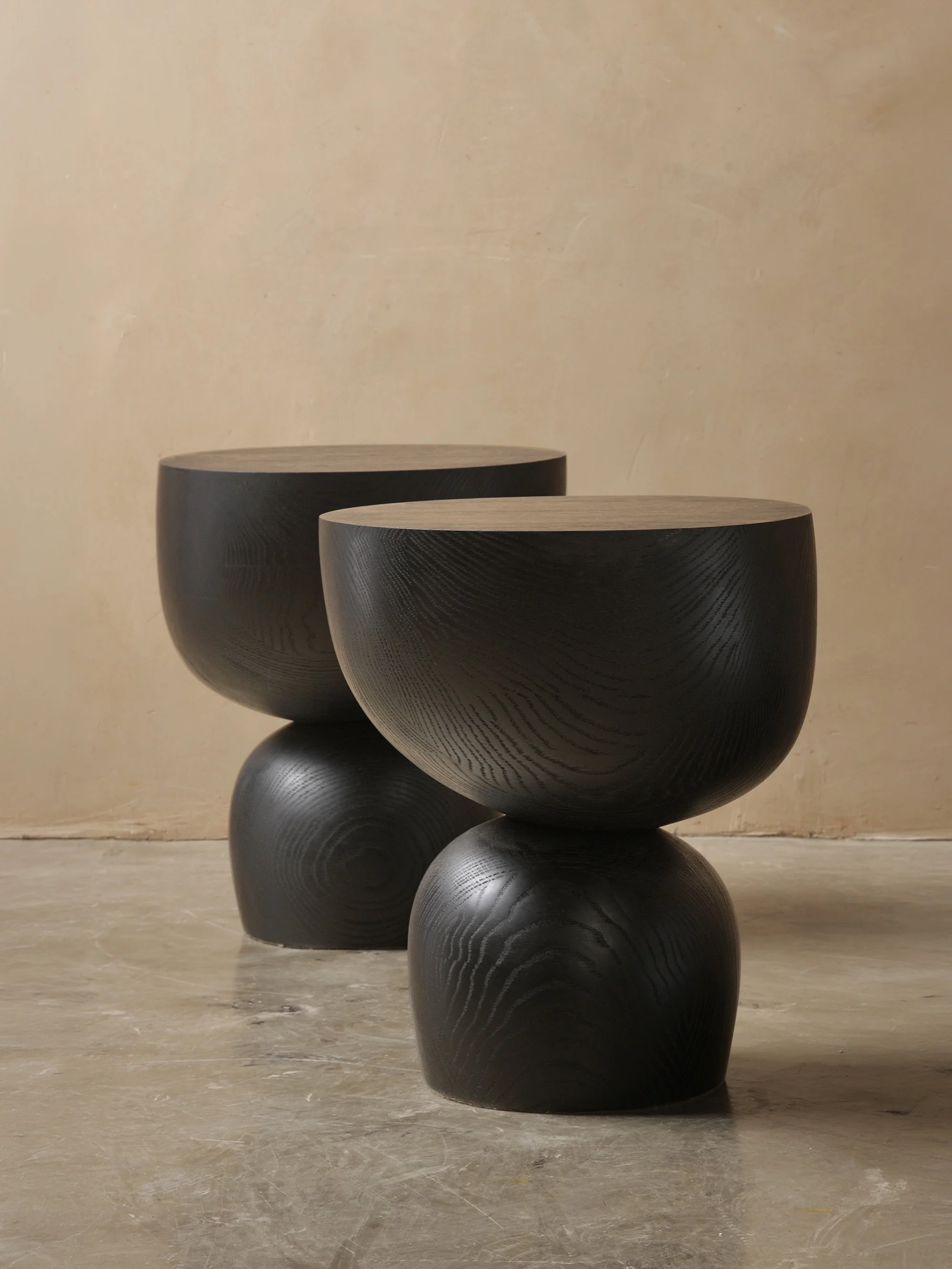 Elefante side table turns a compact side table into a dense architectural object, with black wood reinforcing the gravity already present in its geometry.

#table #furniture #interiordesign