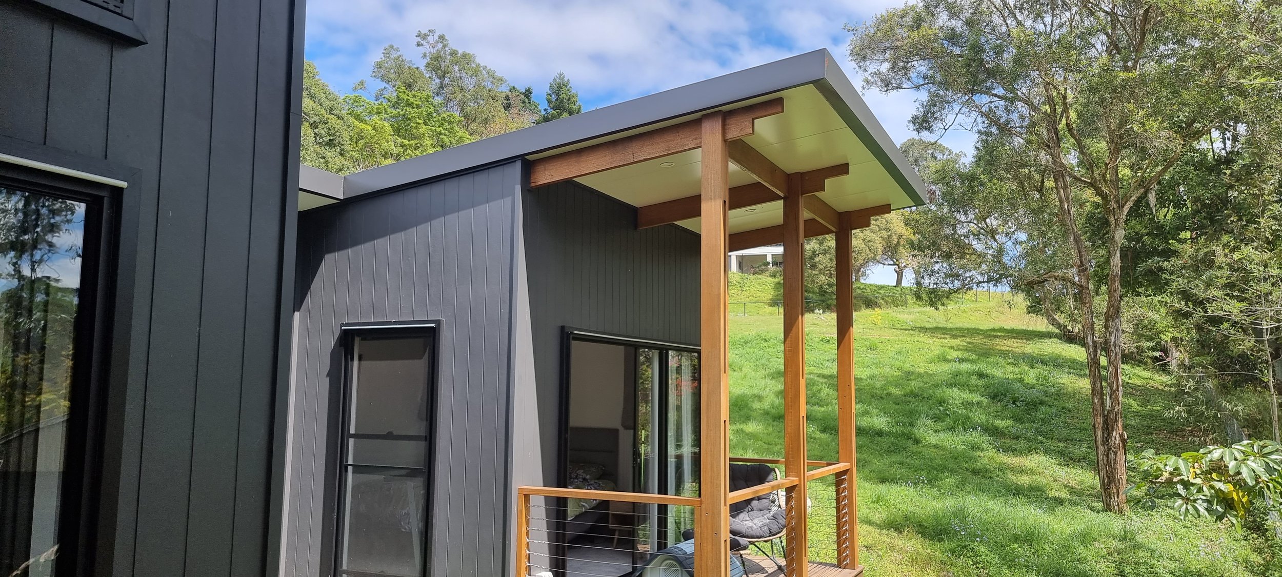 Timber battening bring warm tones and ties in with the landscape
