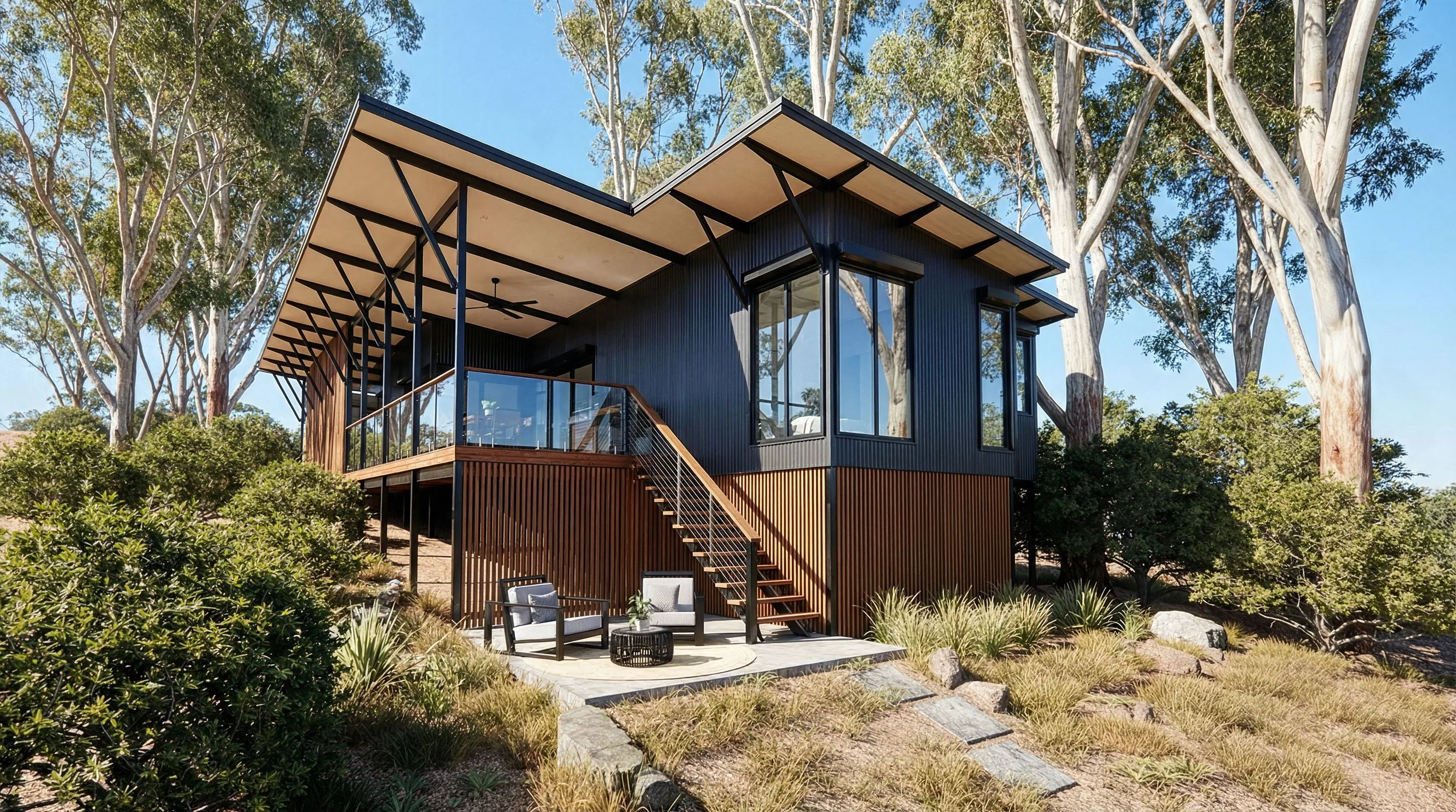 A modern two-story house with a black exterior, large windows, and a spacious balcony surrounded by trees and lush greenery.