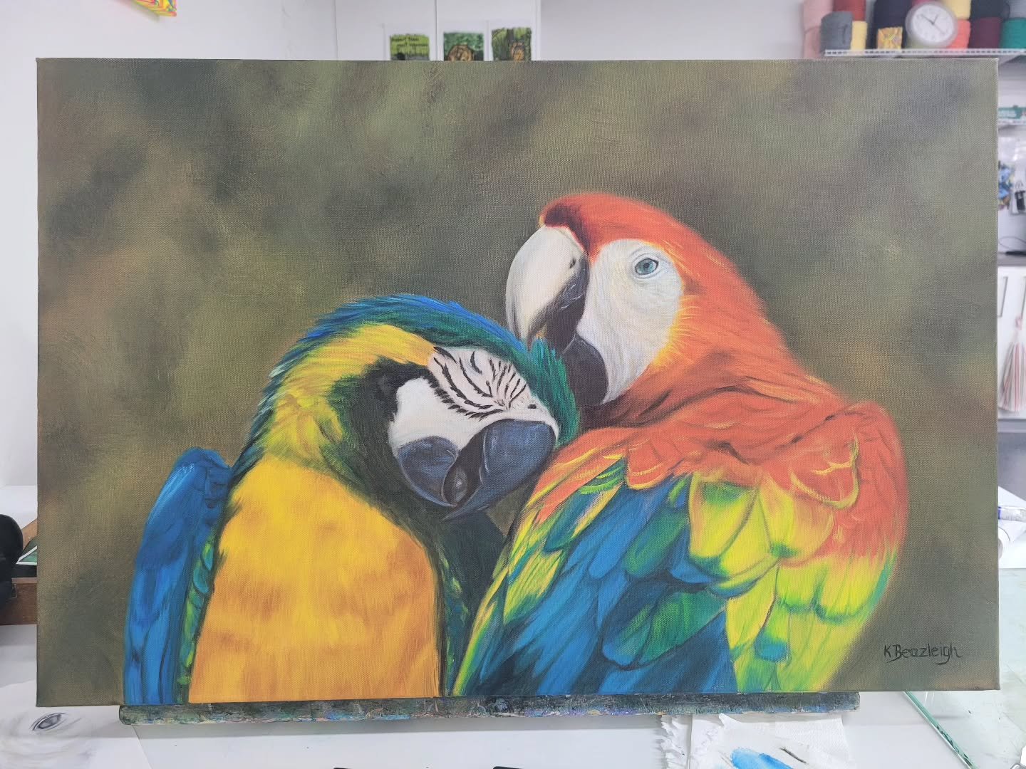 Finished - Day 3 - Today, I worked on enhancing the details of their faces, especially the blue parrot. I also added a few adjustments to the top feathers of that parrot as well.
I managed to get it finished a week before the deadline for the upcomi
