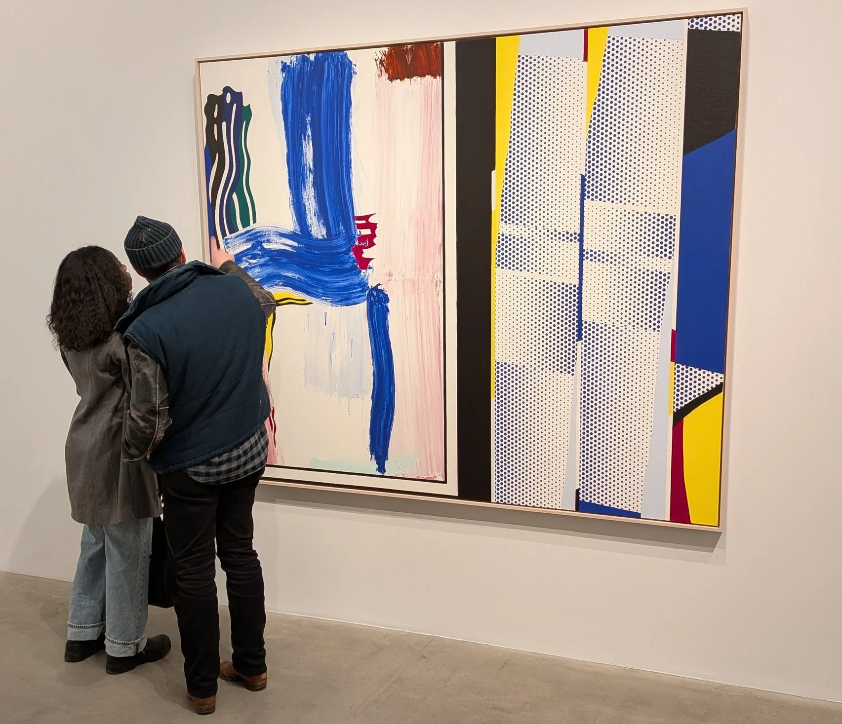 Two visitors stand before Roy Lichtenstein's Painting: Mirror (1984) at Gagosian Chelsea, examining the large-scale work.
