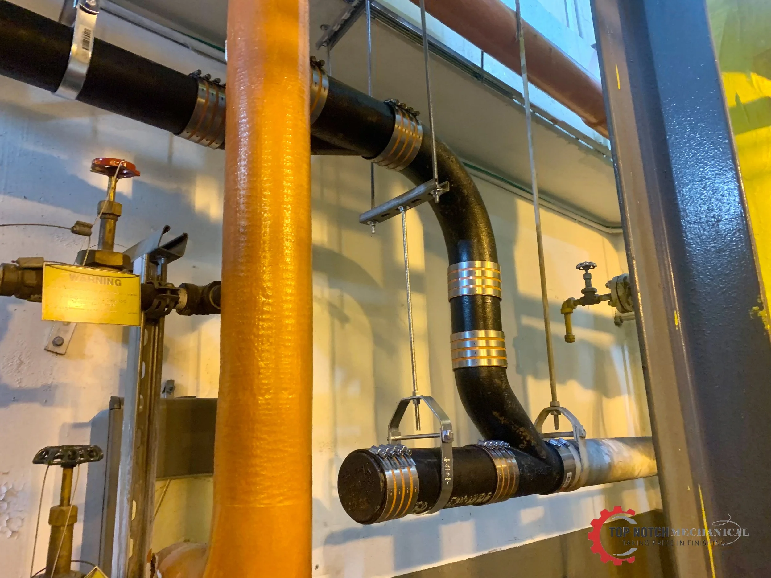 Hanging House Trap 2_Top Notch Plumbing.JPEG