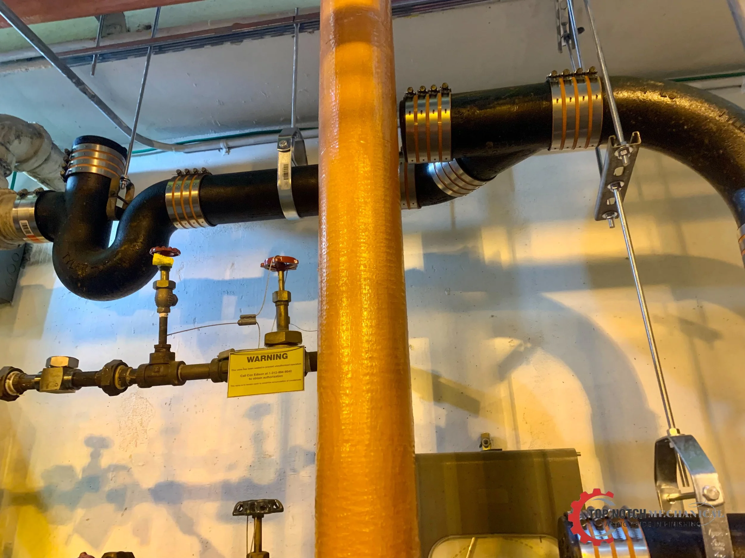 Hanging House Trap_April 18_Top Notch Plumbing.JPEG