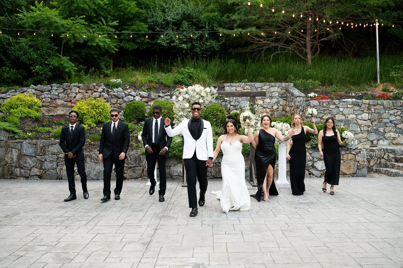 Wedding party photos on Milton Ridge patio following outdoor wedding ceremony