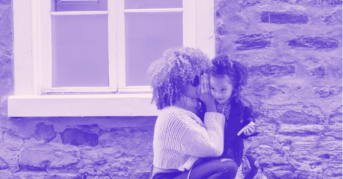black woman whispering to young black child. online therapy for individuals and couples BIPOC