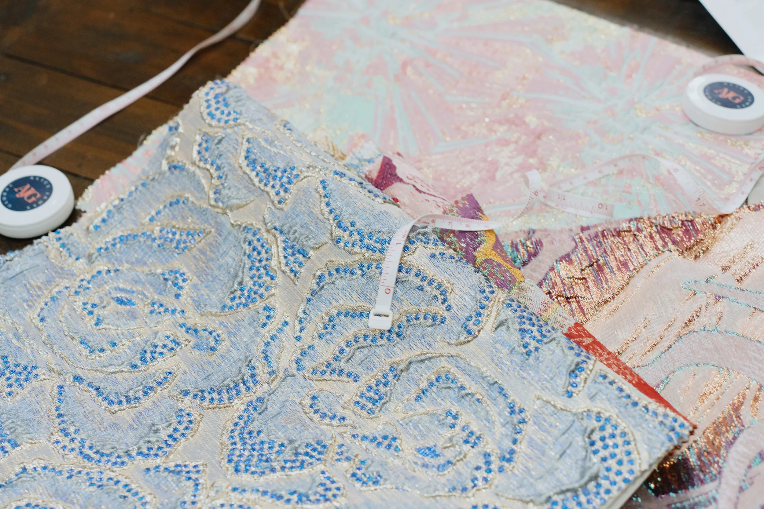 AJG Fashion Consulting fabric sourcing process showing detailed textile textures for emerging ethical fashion brands.