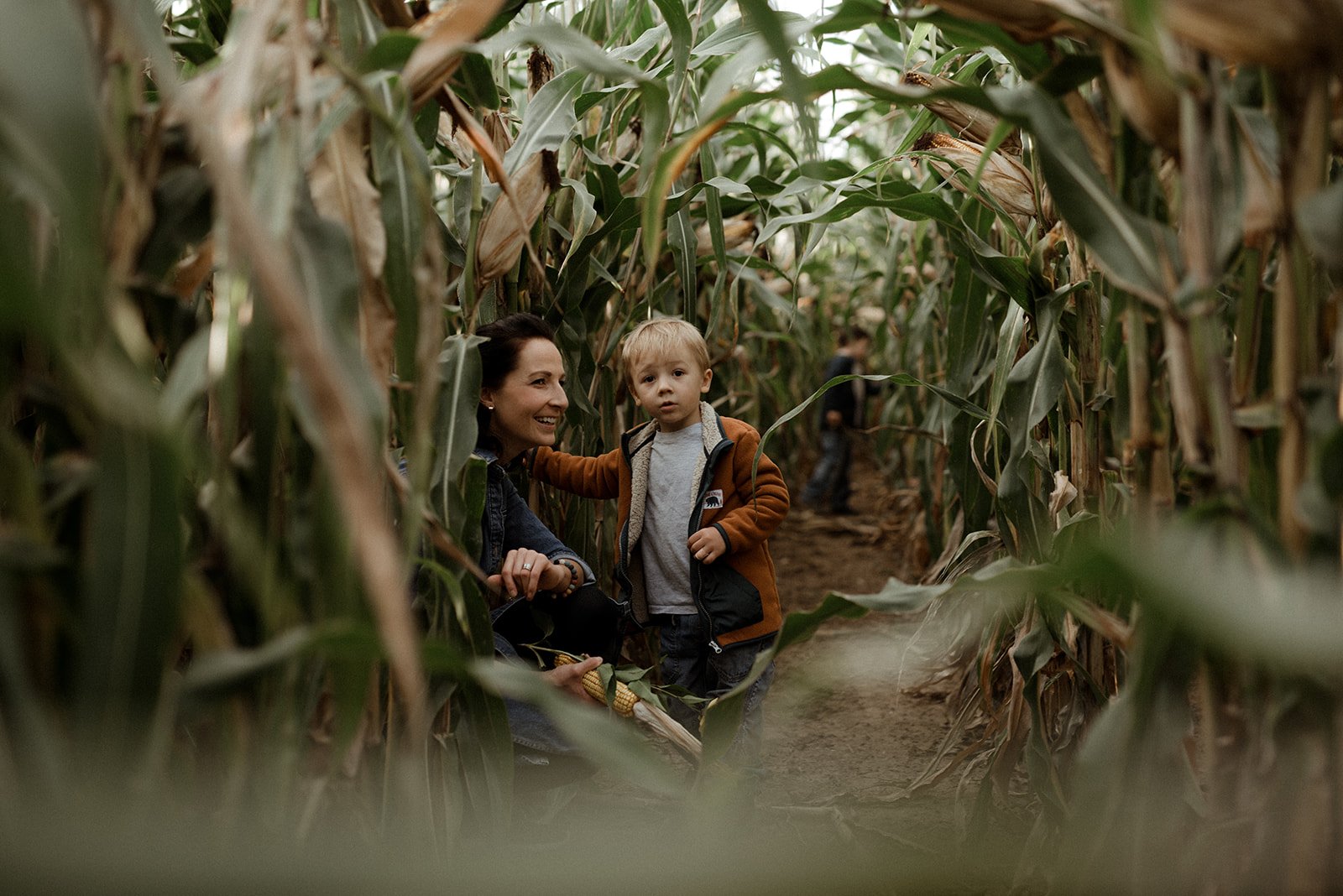 Mother and son in a cornfield