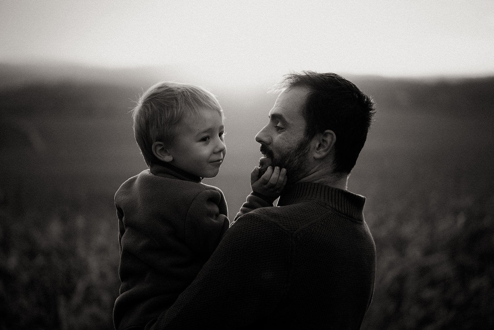 black and white photo of son and father