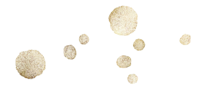 Mehrere Kleckse von goldener Tinte in verschiedenen Größen auf mehreren farbigen Linien auf weißem Hintergrund.