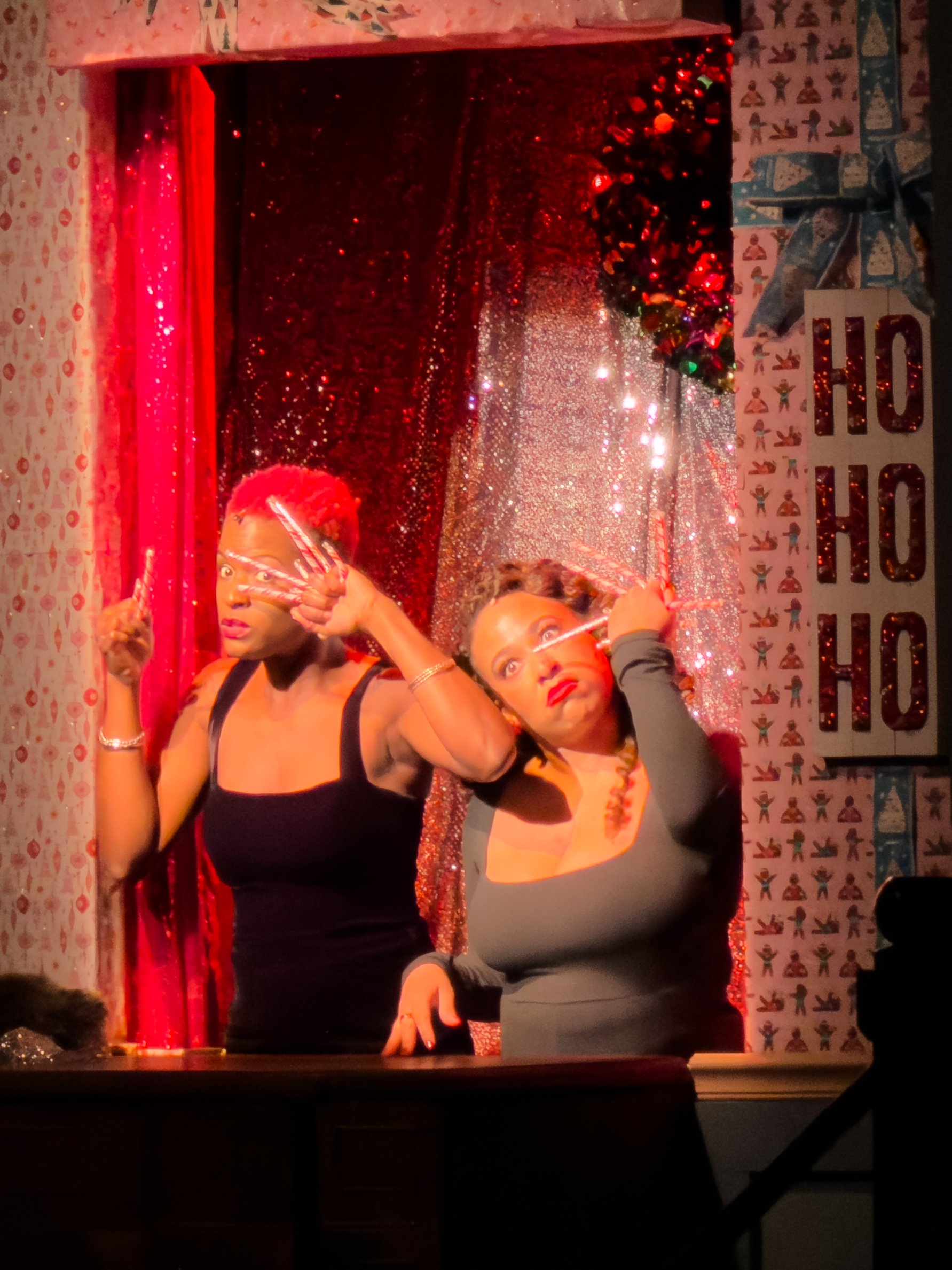 Lulu and Bryana singing about candy canes in the puppet window