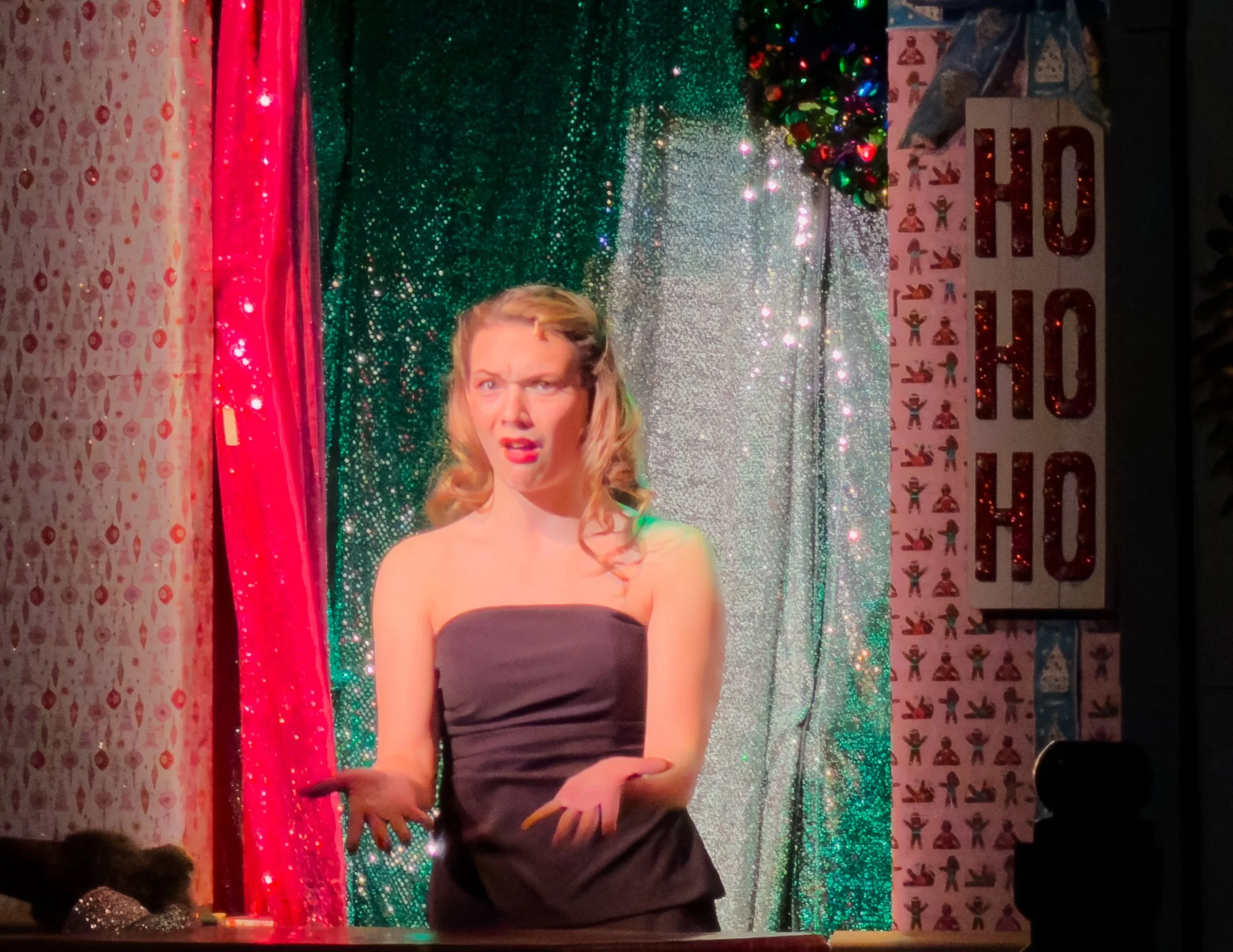 Mariah sings an interlude in the puppet window