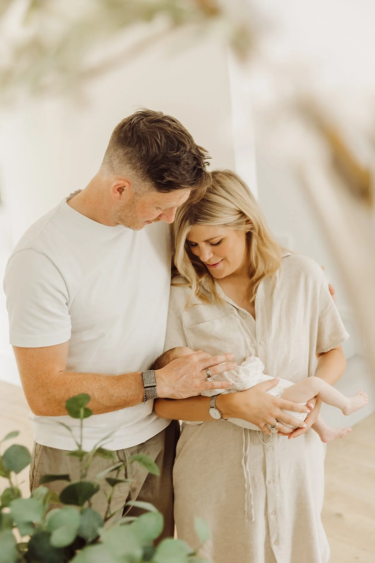 Mum and Dad creative portrait with newborn.
