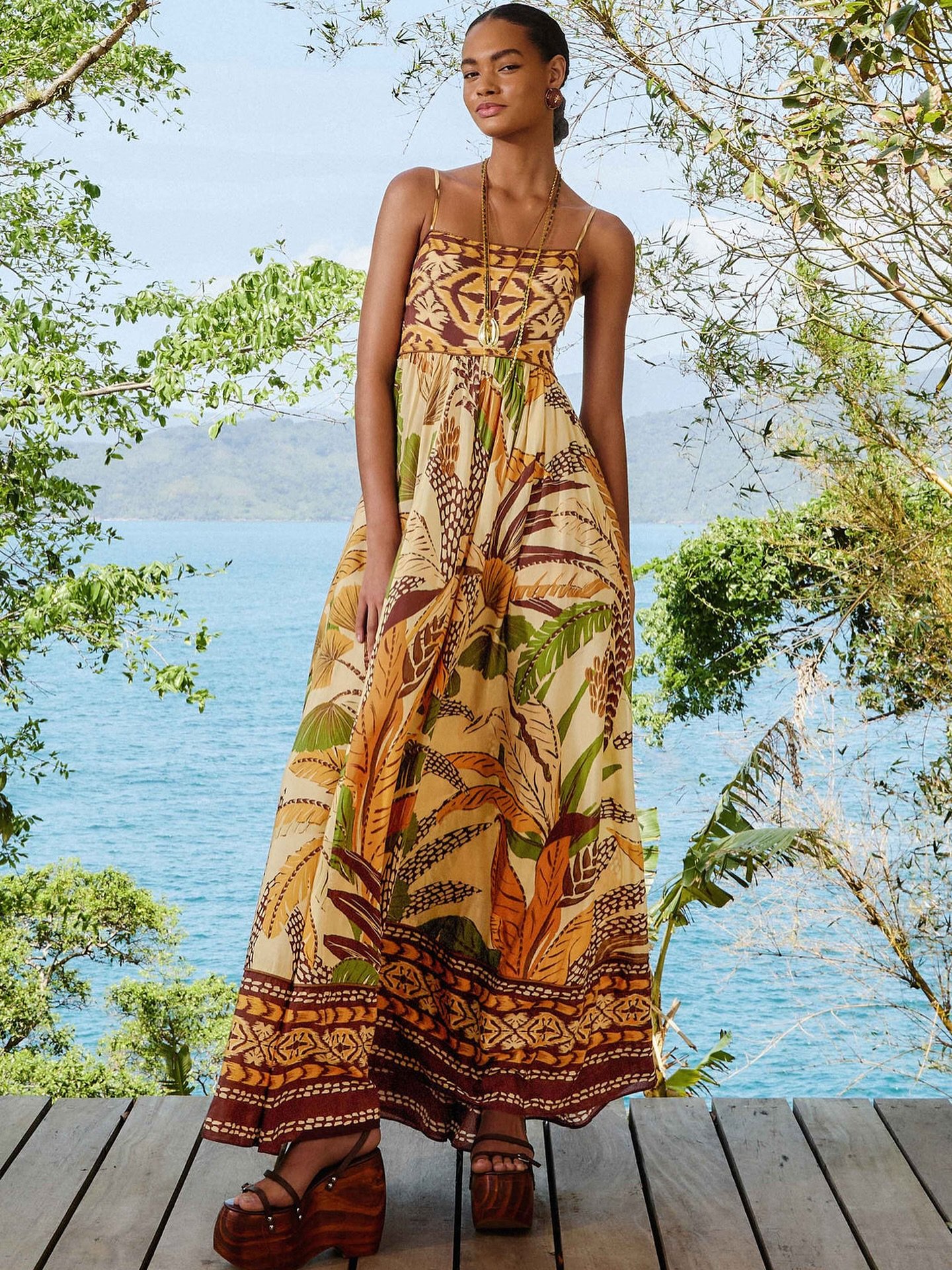 Coming Soon 🌿

The Sand Foliage Sketch Maxi Dress by FARM Rio. This captivating piece features a square neckline and a mesmerizing blend of earthy tones and vibrant foliage patterns. The dress flows gracefully with its maxi length, capturing the ess