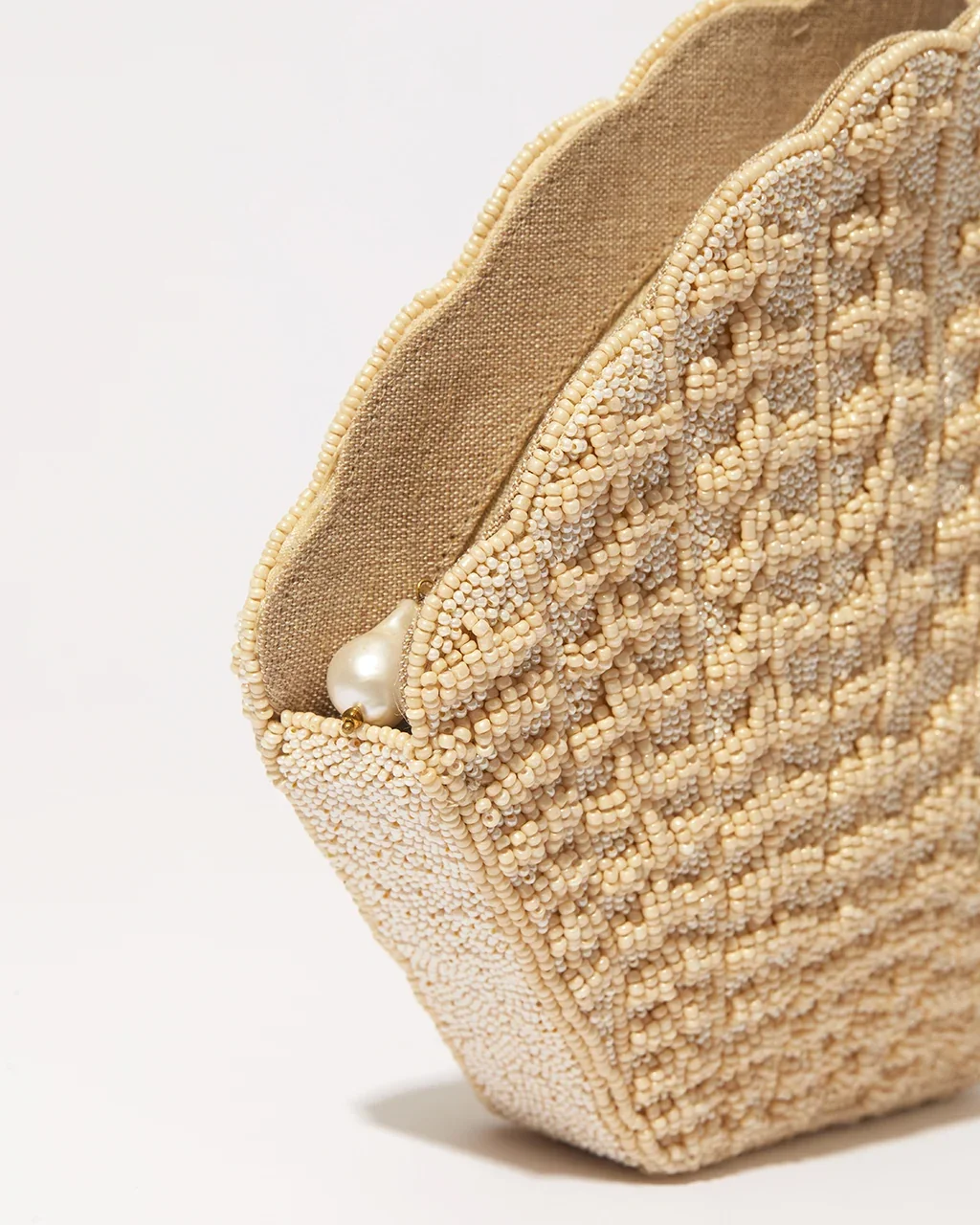 the-hold-stand-still-beaded-shell-clutch-champagne-4.webp