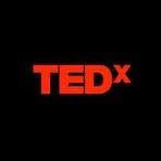 TEDx logo in red text on black background