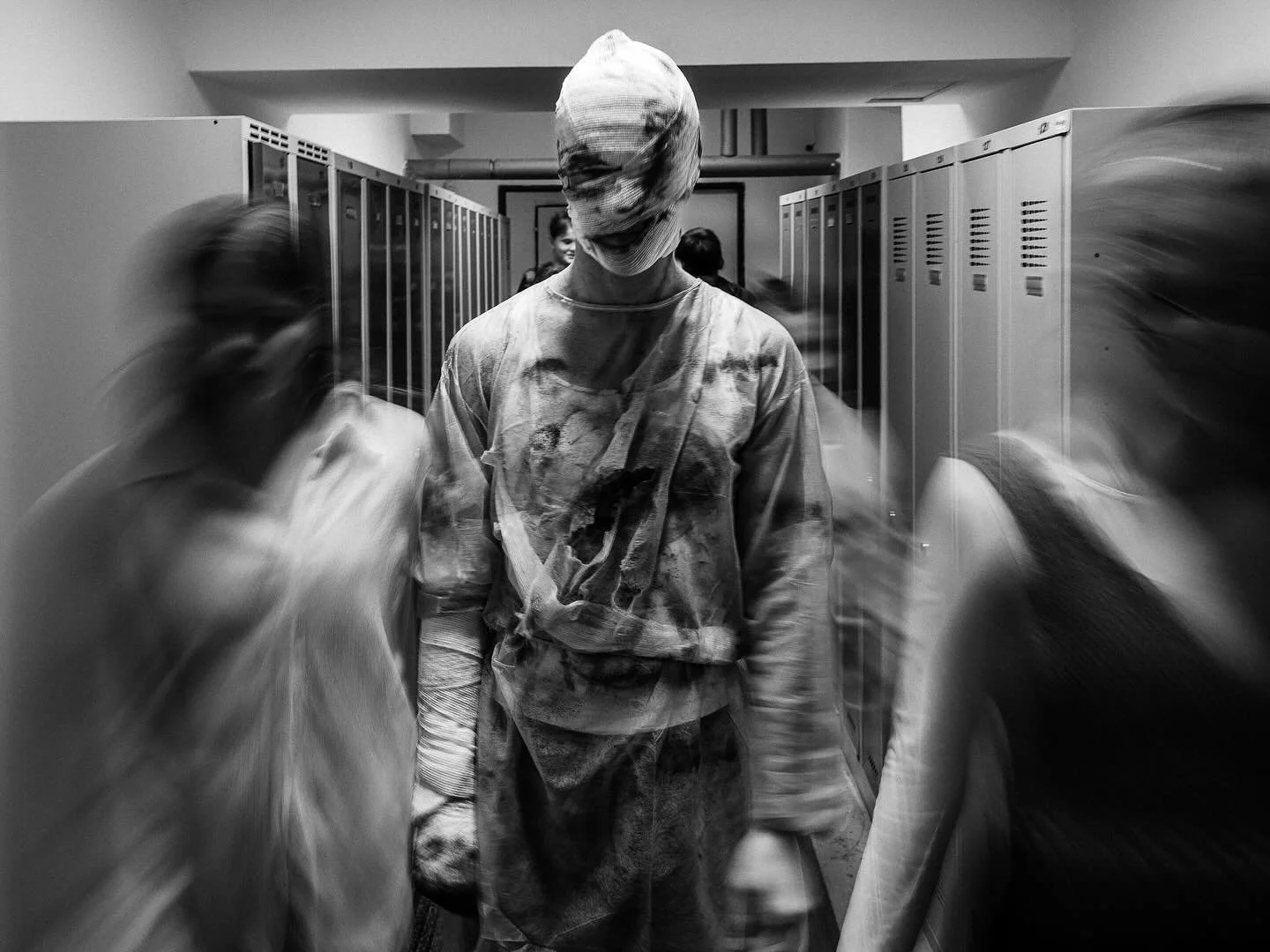 Soulless Hallways 👻

On my way to a service, I saw them &mdash; bandaged, silent, unreal.

So I followed&hellip; and suddenly, it didn&rsquo;t feel like Halloween anymore.

In that locker room, it looked like a scene from real life &mdash;
students 