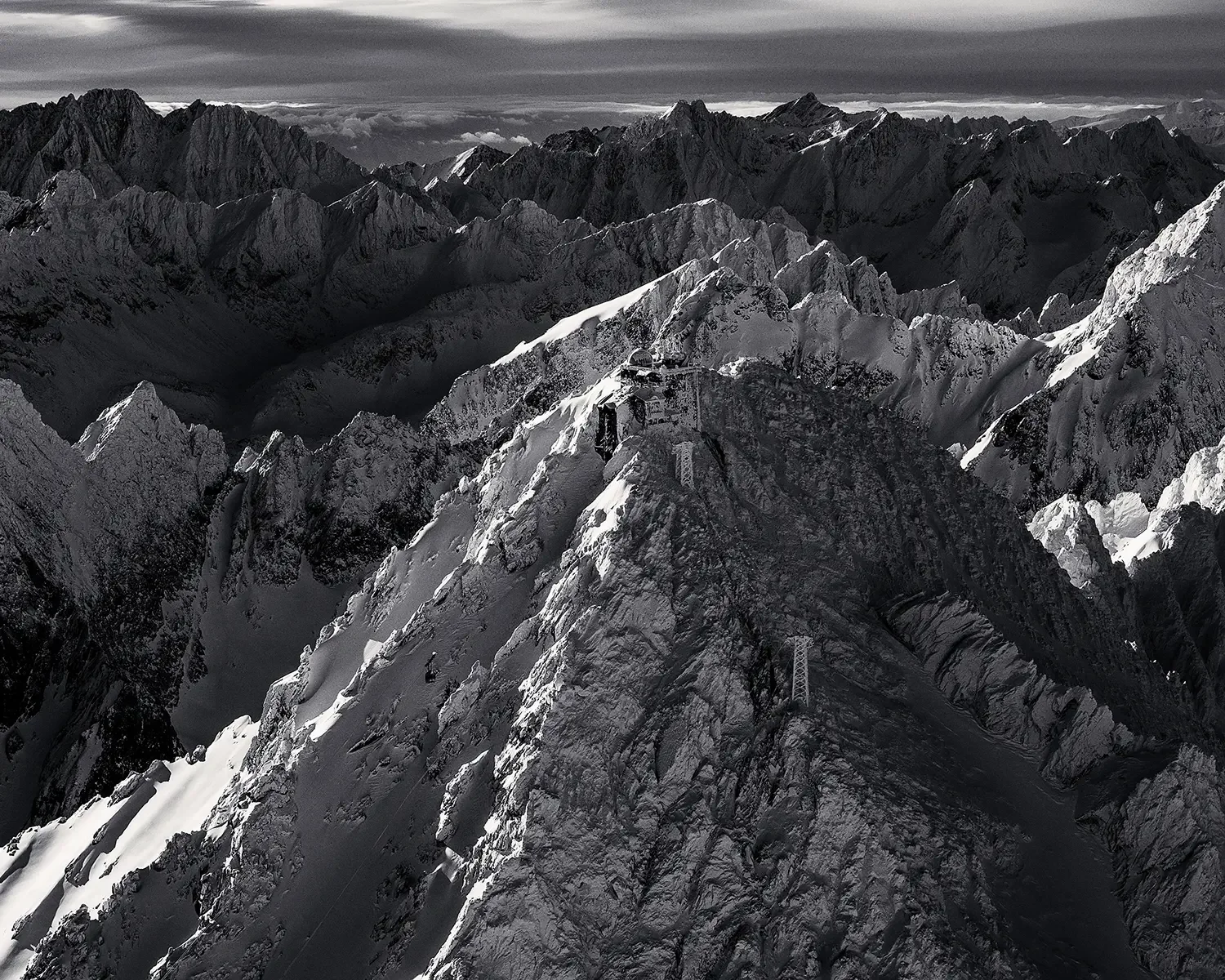 High Tatras and peak Lomnicky stit in dark ooody winteer landscape