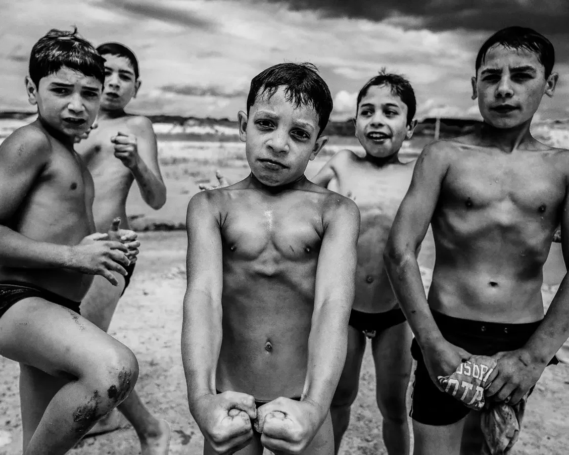young roma boys posing as fighters