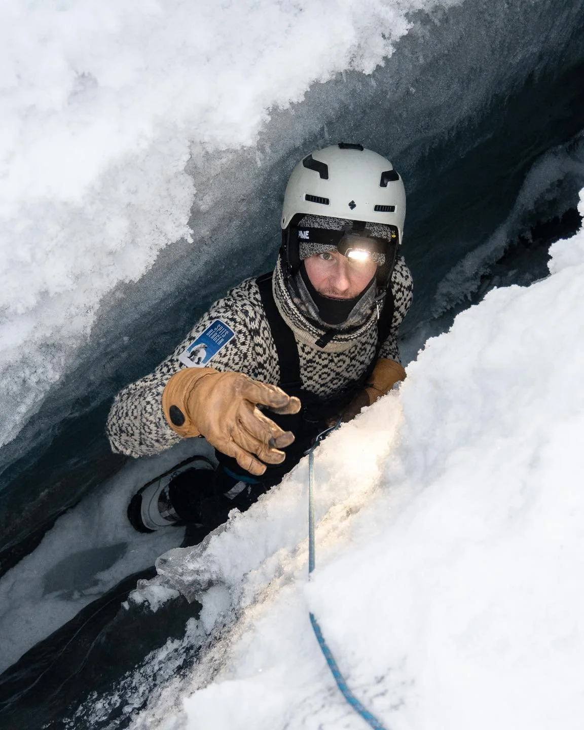 Checking out into a crevasse making sure it is drivable above on snowmobile. Traveling on glaciers mean to be always aware about what you are stepping on. 
Thanks @florian_ledoux_photographer for the photos.  #crevasses #iceclimbing #climat