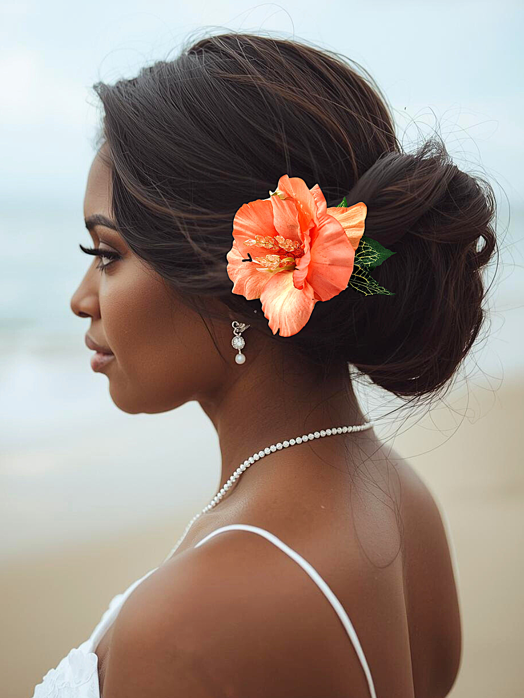 black woman on beach wearing tropical silk orange hibiscus hair clip