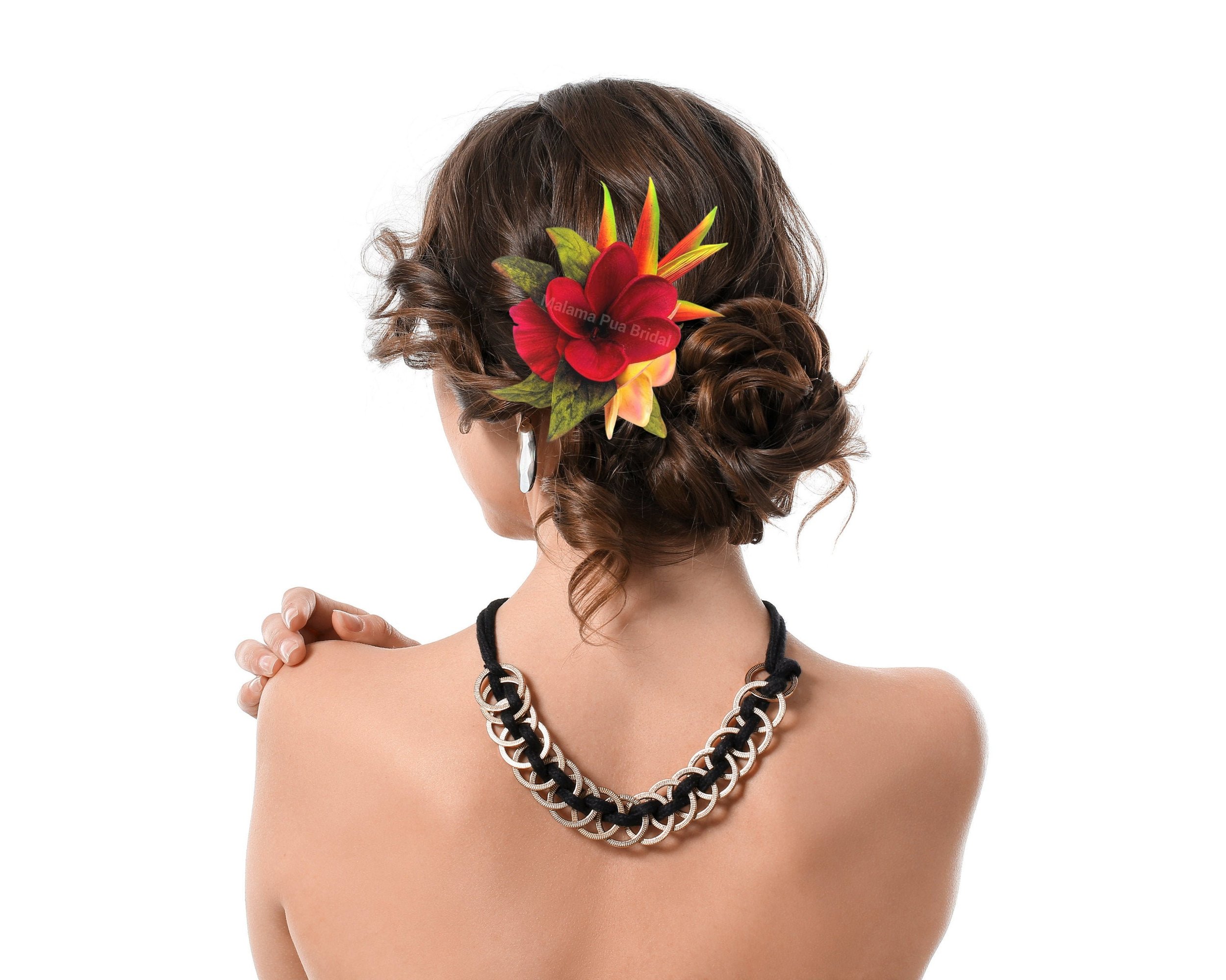 Woman wearing a Tropical Hawaiian Headpiece with Silk Hawaiian Heliconia and Red and Yellow real touch plumeria with hand wired Swarovski crystal centers.