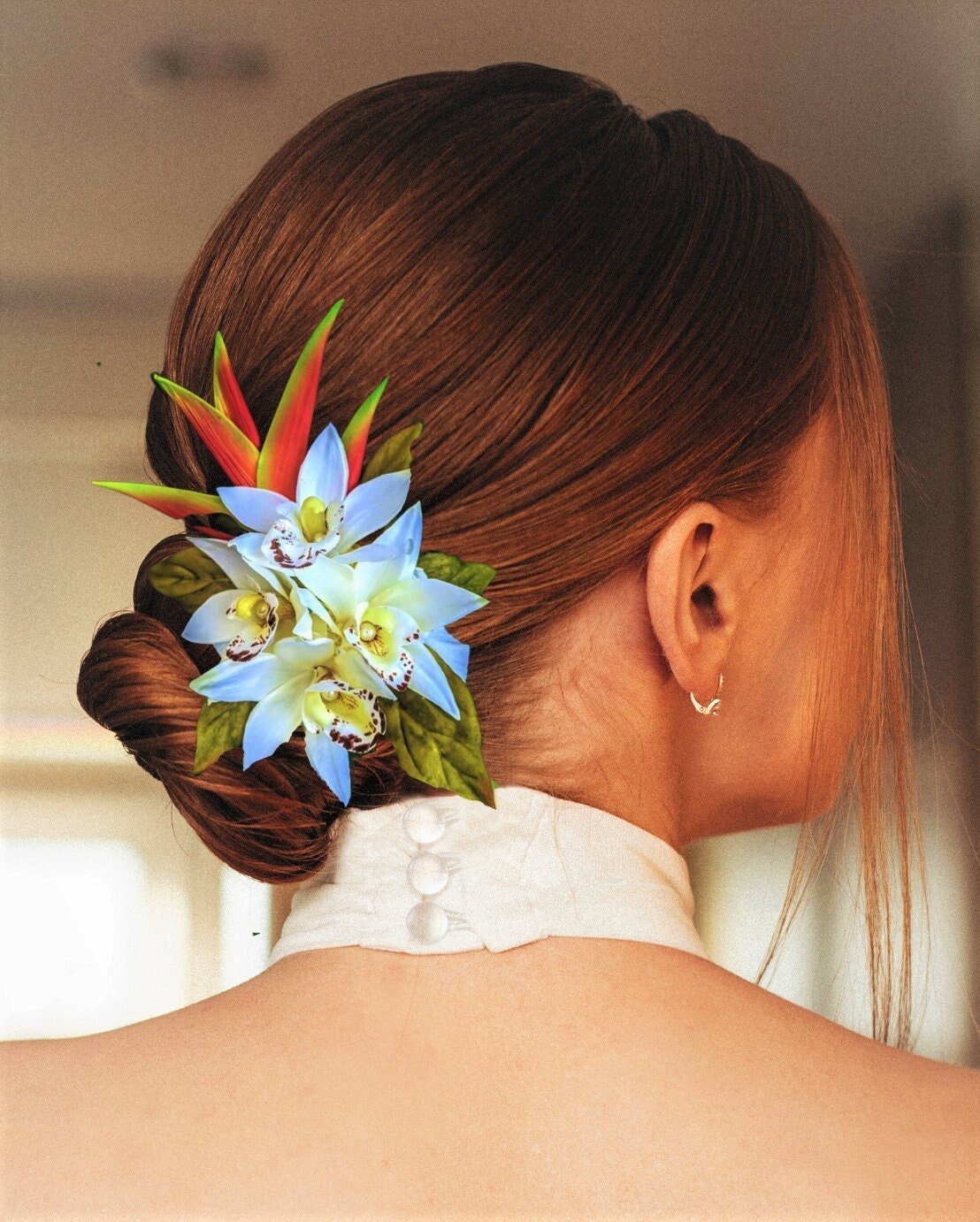 Bride wearing custom made Wedding Hair accessory with white silk orchids and Hawaiian Heliconia