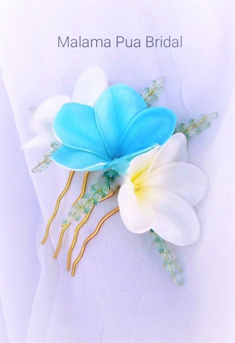 Bride wearing Tropical Real Touch White and Turquoise plumeria hair comb with Swarovski pearls or crystals