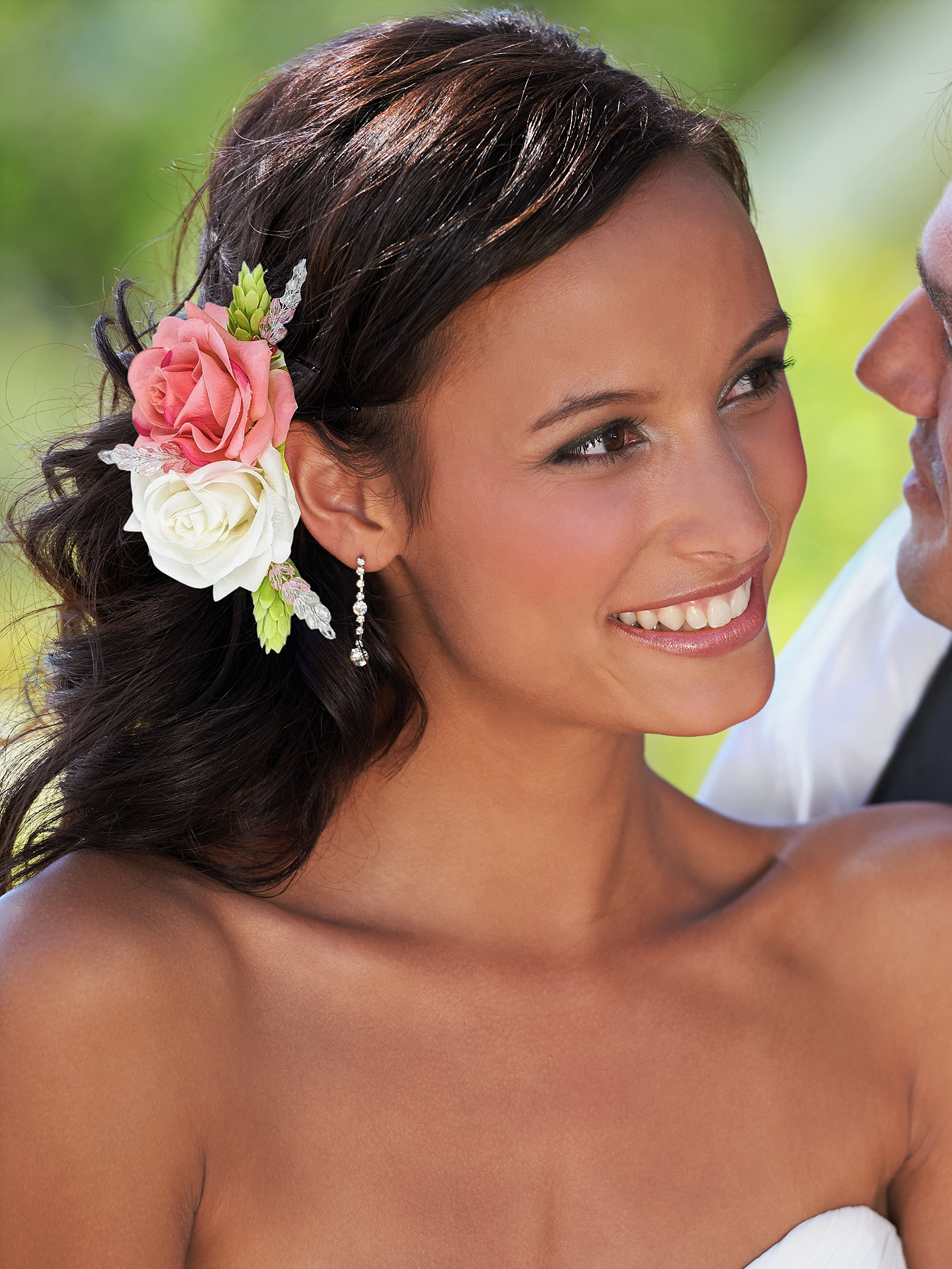 bride wearing pink and white silk rose hair clip