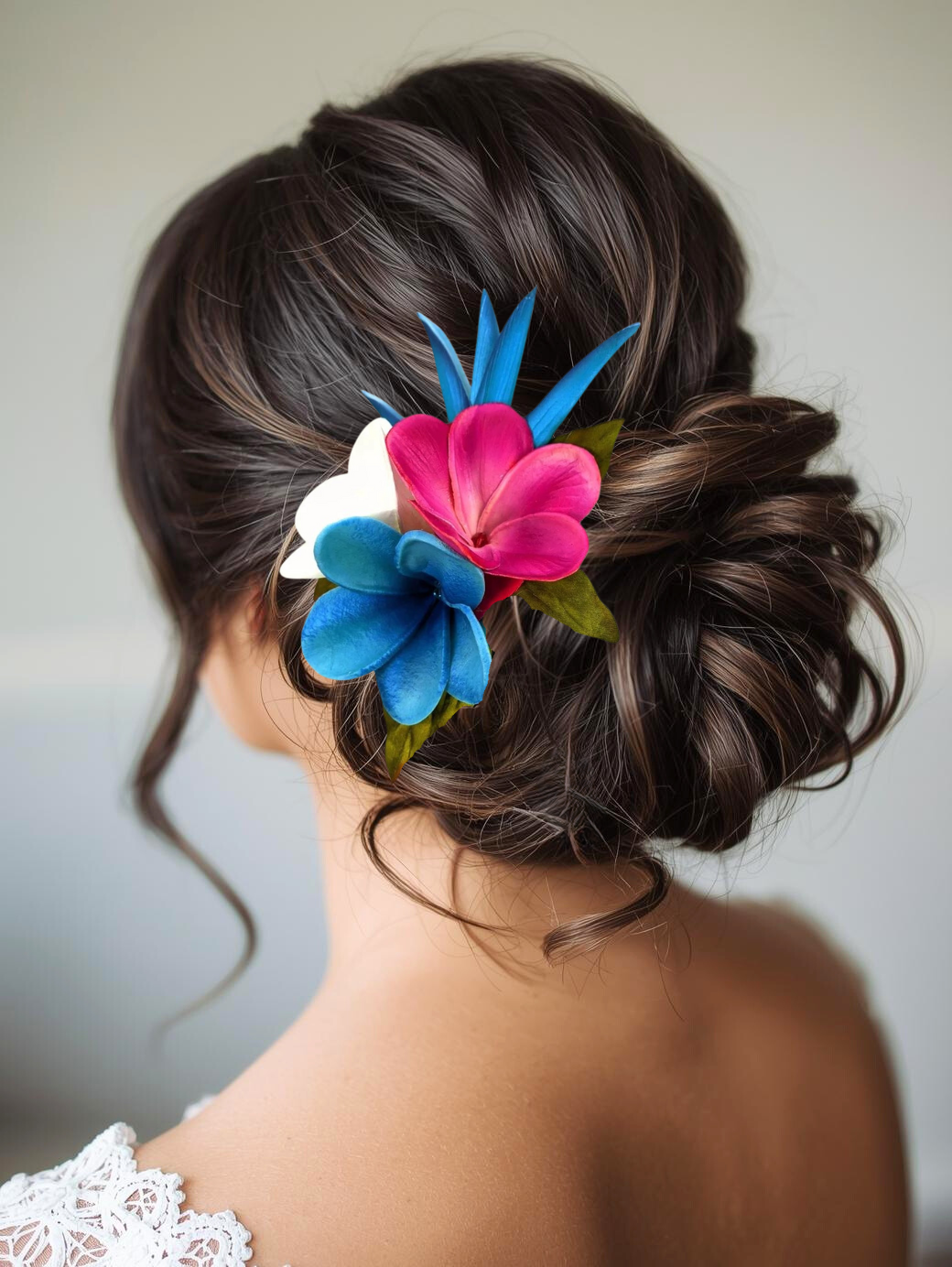Bride wearing tropical blue helicona and plumeria headpiece for wedding