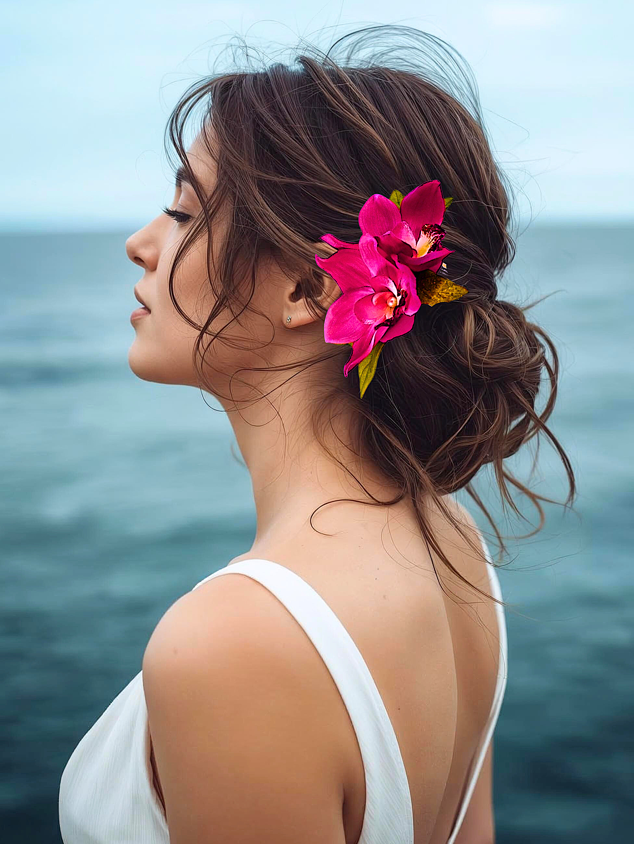 Bride on beach wearing double fuchsia silk orchid hair comb