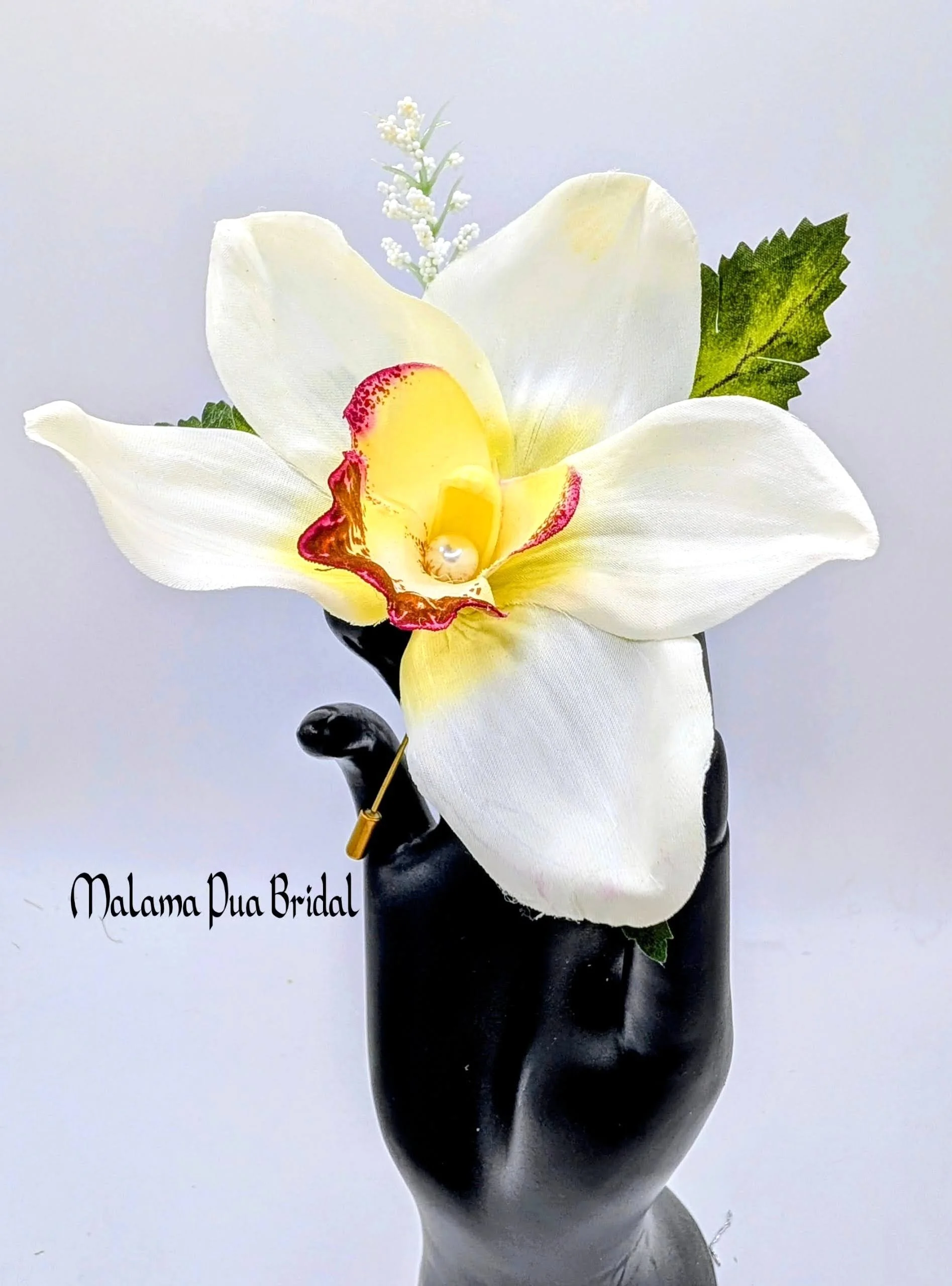 orchid white boutonniere.jpg