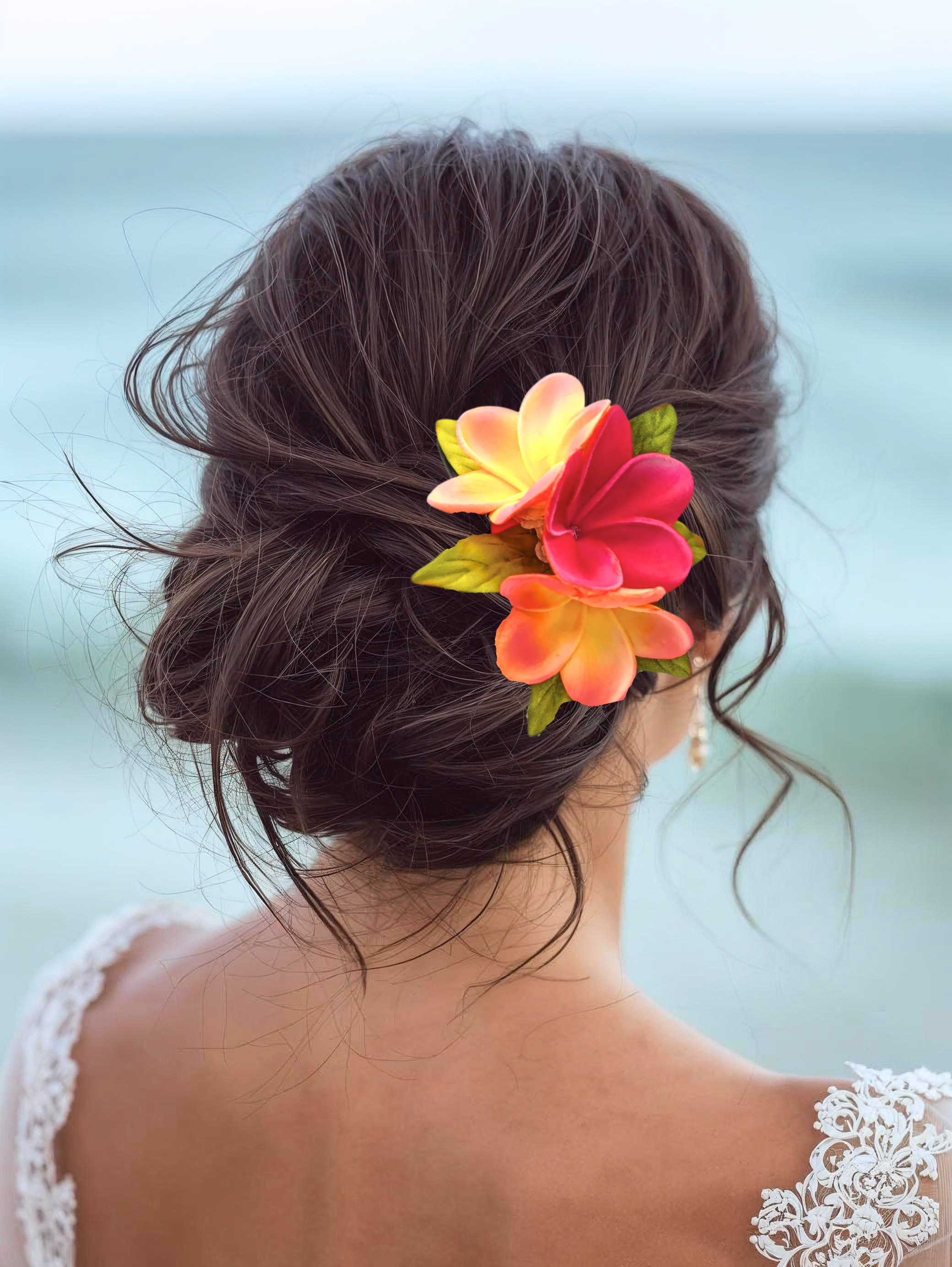 woman on beach with tropical flower hair flowers for wedding